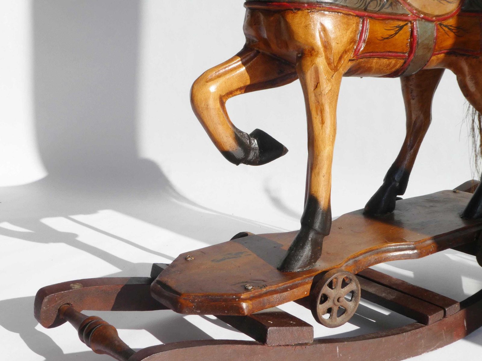 Wood Carved Rocking Horse With Glass Eyes, Carousel Horse With Floral Painted Details, Old Animal Toy On Wheels, Art Object photo vinterior