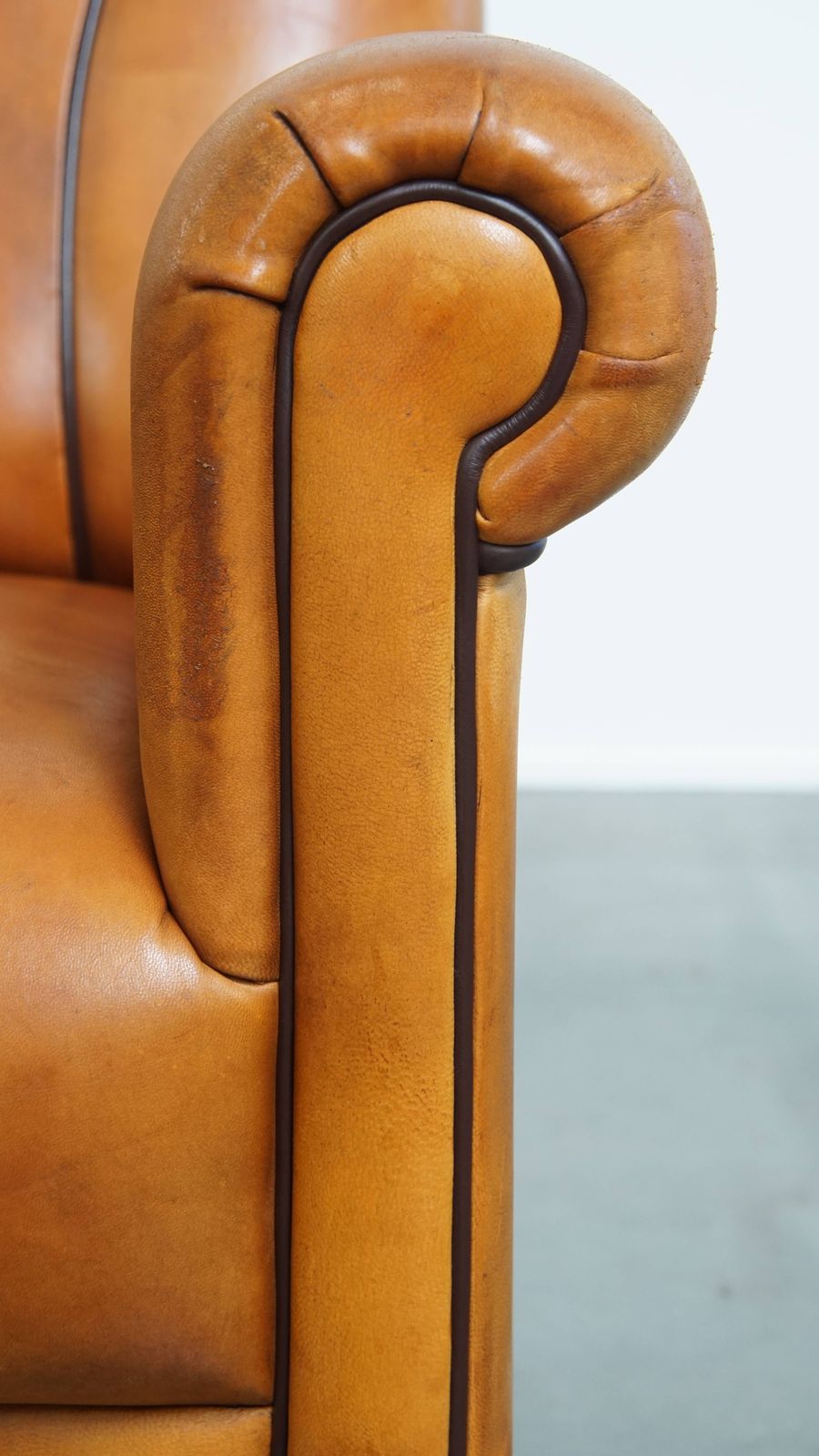 Furniture Beautiful Sheepskin Design Armchair With A Luxurious Finish With Dark Brown Piping photo