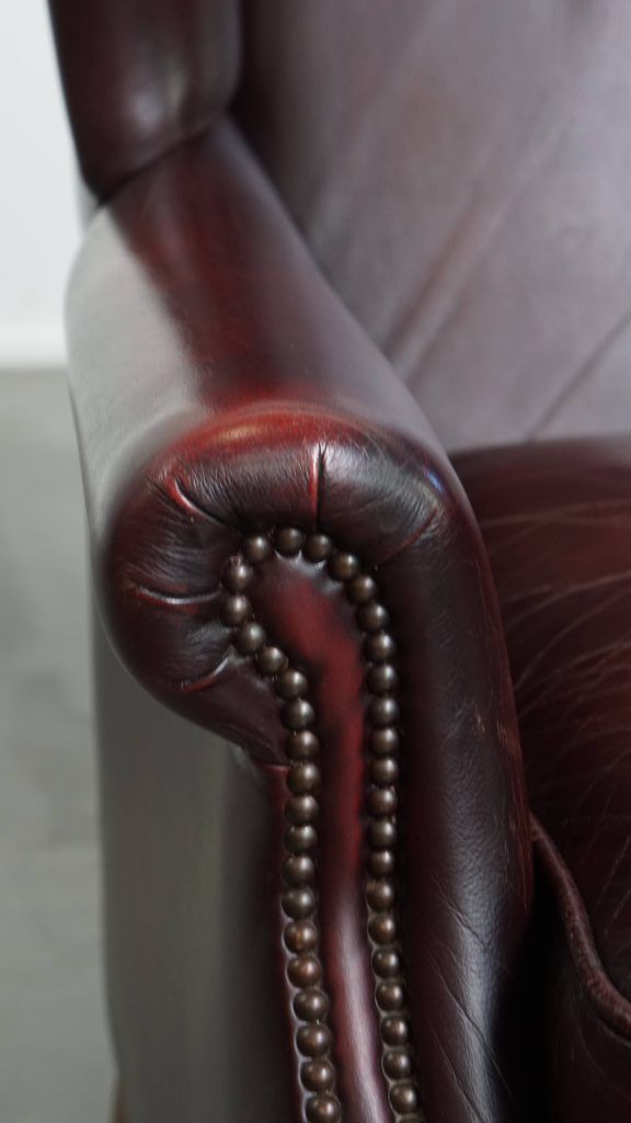 1895.0 Set Of 2 Beautiful And Comfortable Burgundy Red Cowhide Wing Chairs In English Style With A Beautiful Patina photo