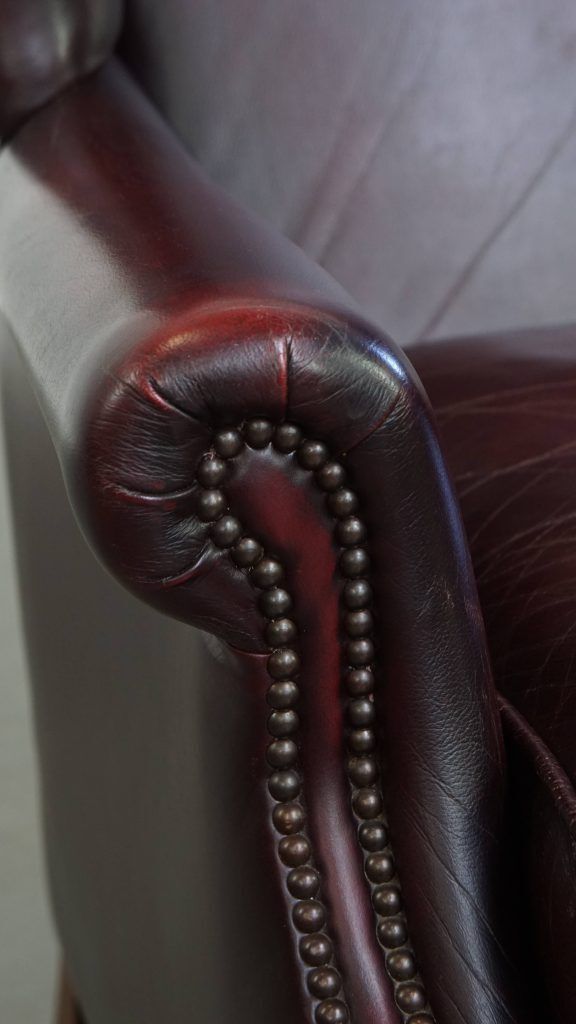 Furniture Charming And Comfortable Burgundy Red Cowhide Wing Chair In English Style With A Beautiful Patina photo