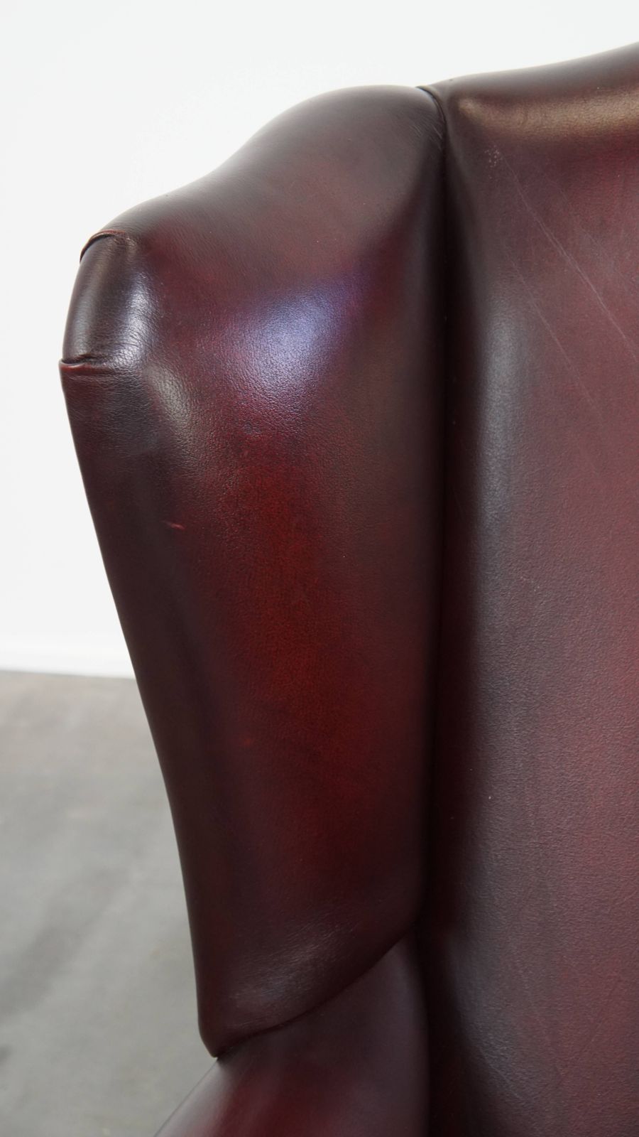 Furniture Beautiful And Comfortable Burgundy Red Cowhide Wing Chair In English Style With A Wonderful Patina photo