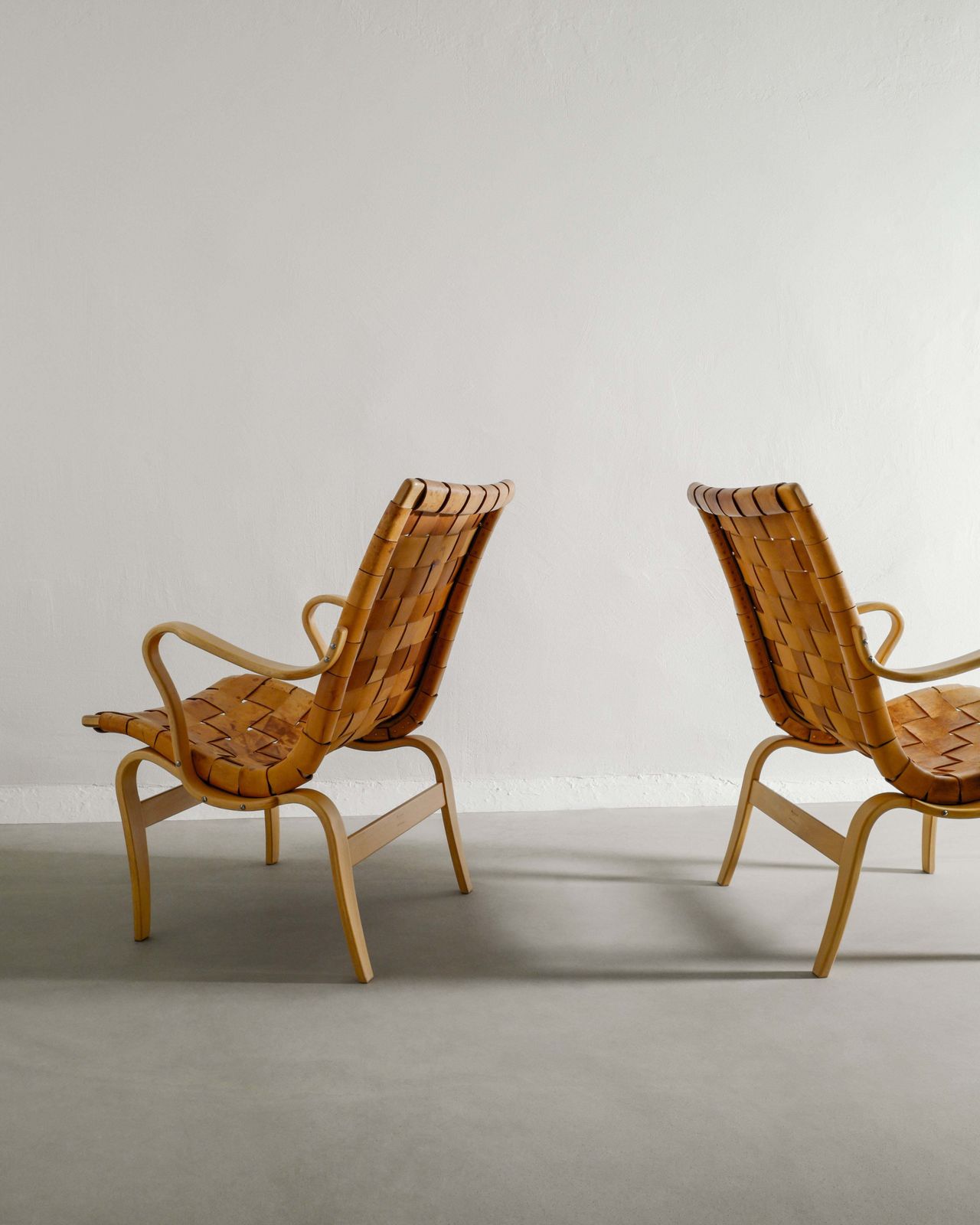 A Pair Of Swedish Mid Century Wooden "Eva" Armchairs In Birch & Patinated Leather By Bruno Mathsson, 1970s