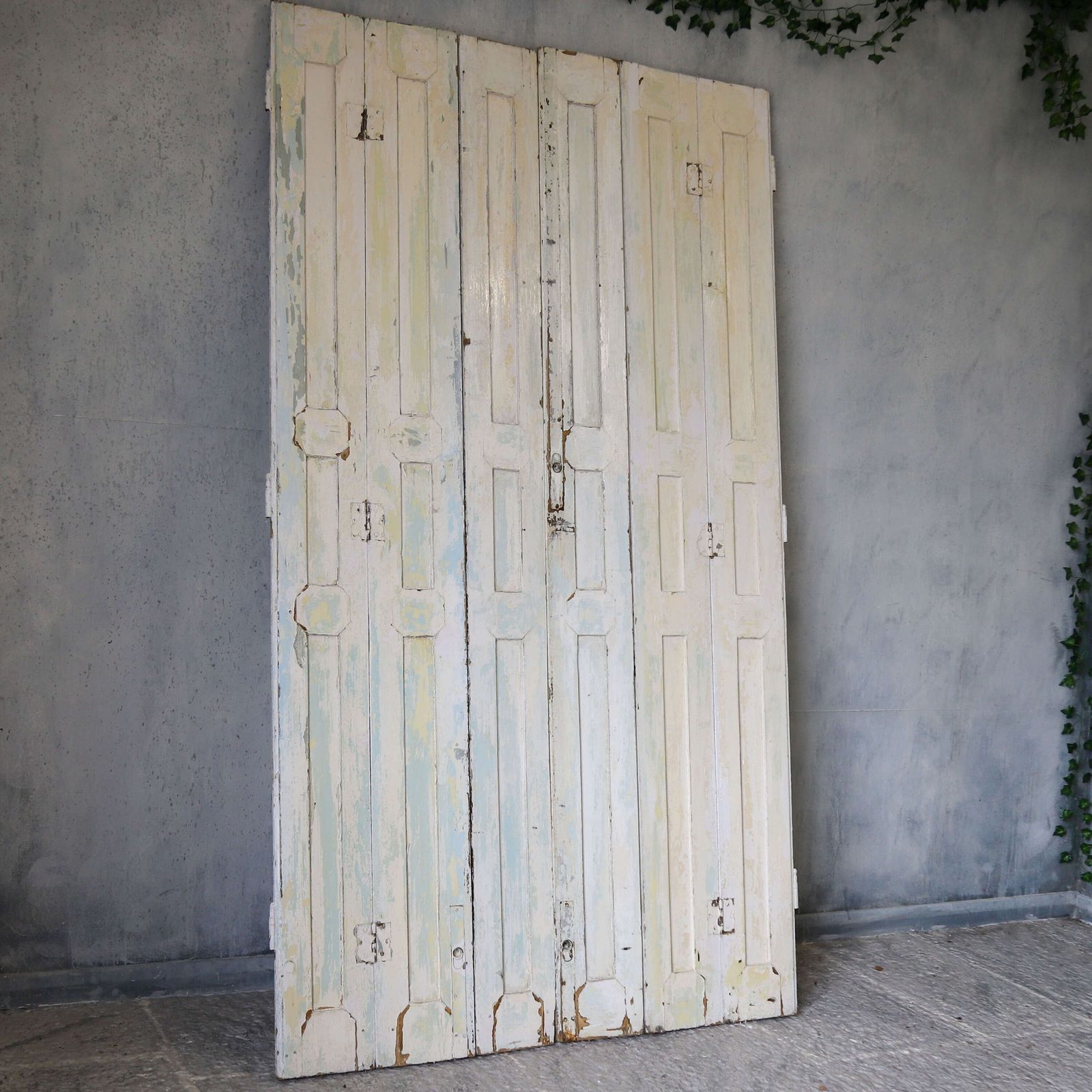 Pair Of Antique Panelled Tri Folding Shutters In Original Cream Paint photo vinterior