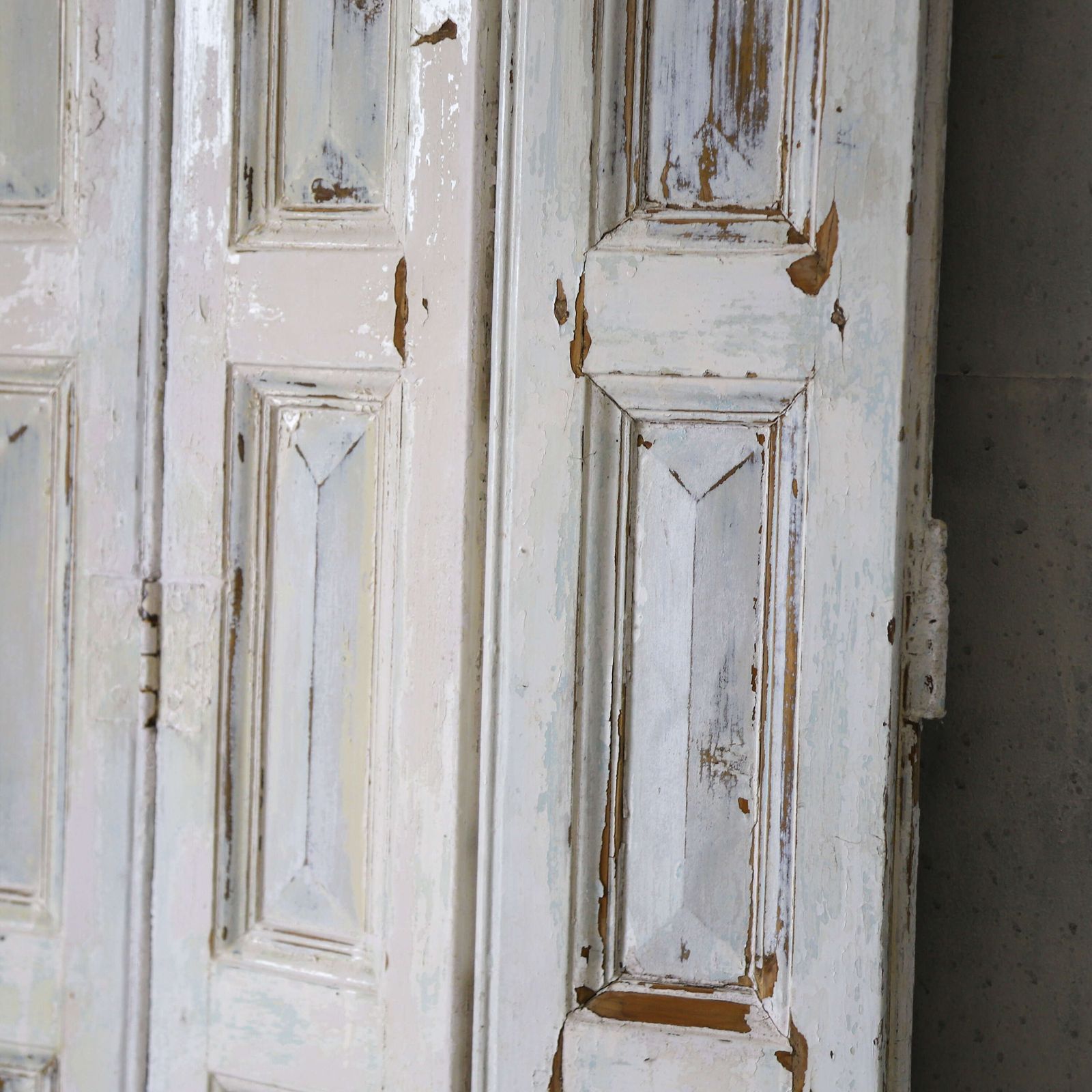 Pair Of Antique Panelled Tri Folding Shutters In Original Cream Paint photo vintage