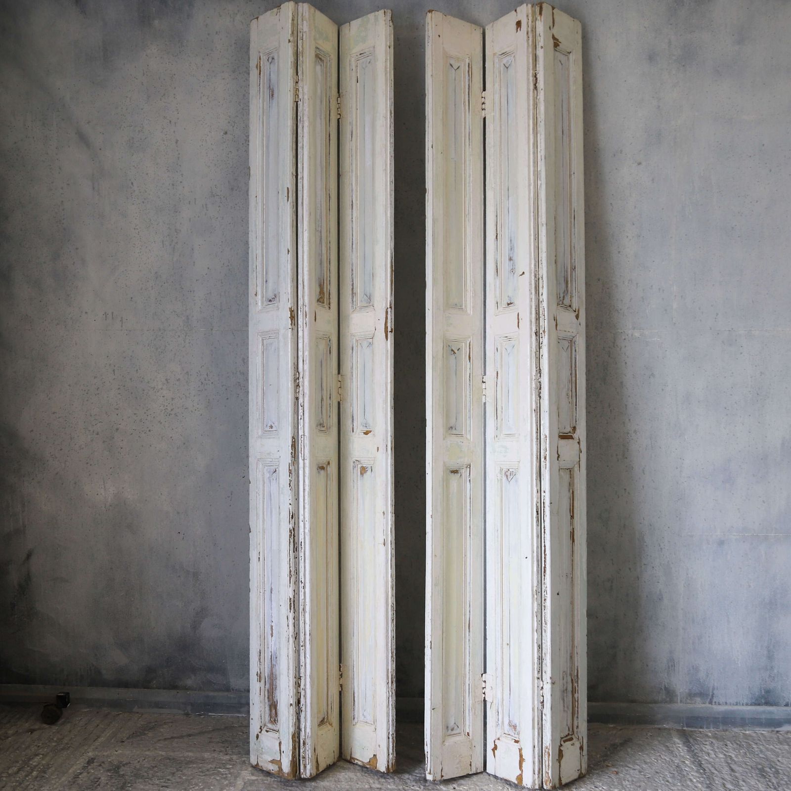photo buy Pair Of Antique Panelled Tri Folding Shutters In Original Cream Paint