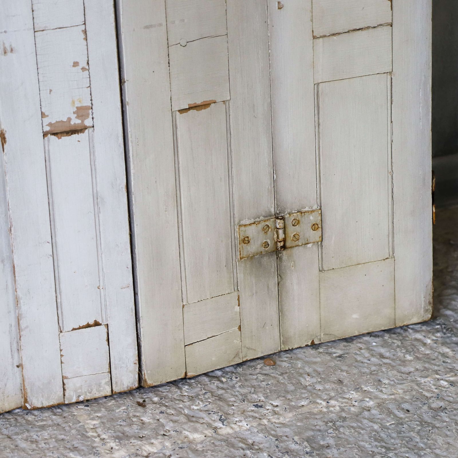 Pair Of Antique Panelled Tri Folding Shutters In Original Cream Paint photo for sale