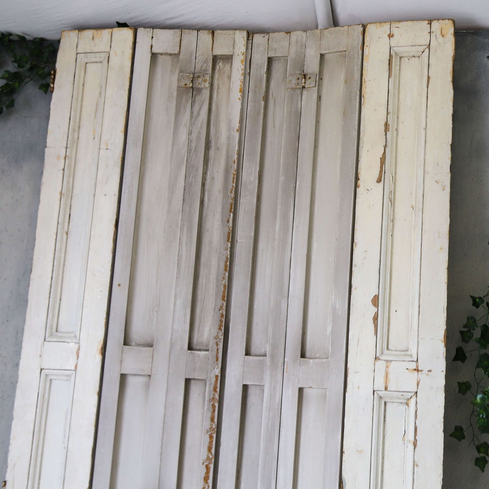 photo furniture Pair Of Antique Panelled Tri Folding Shutters In Original Cream Paint