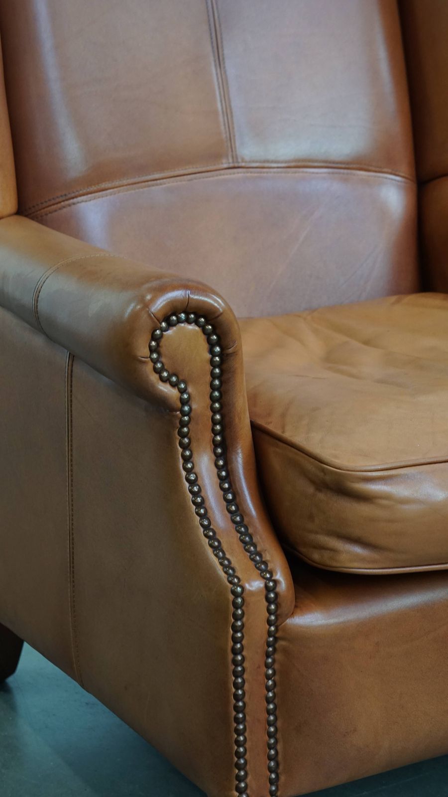 878.0 Classic And Unique Cowhide Wing Chair Finished With Decorative Nails And Beautiful Details photo