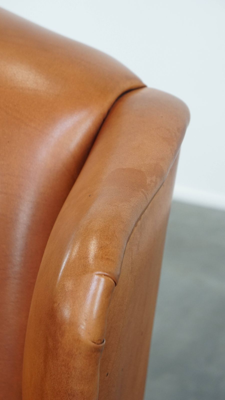 photo vinterior Classic And Unique Cowhide Wing Chair Finished With Decorative Nails And Beautiful Details