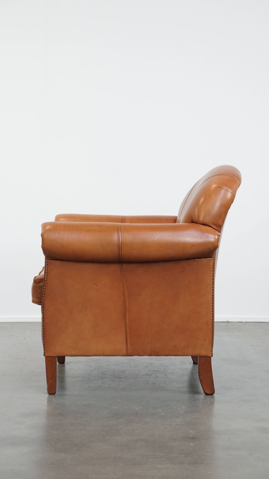 Beautiful And Comfortable Cowhide Leather Armchair In A Warm Cognac Color Finished With Decorative Nails photo 839.0