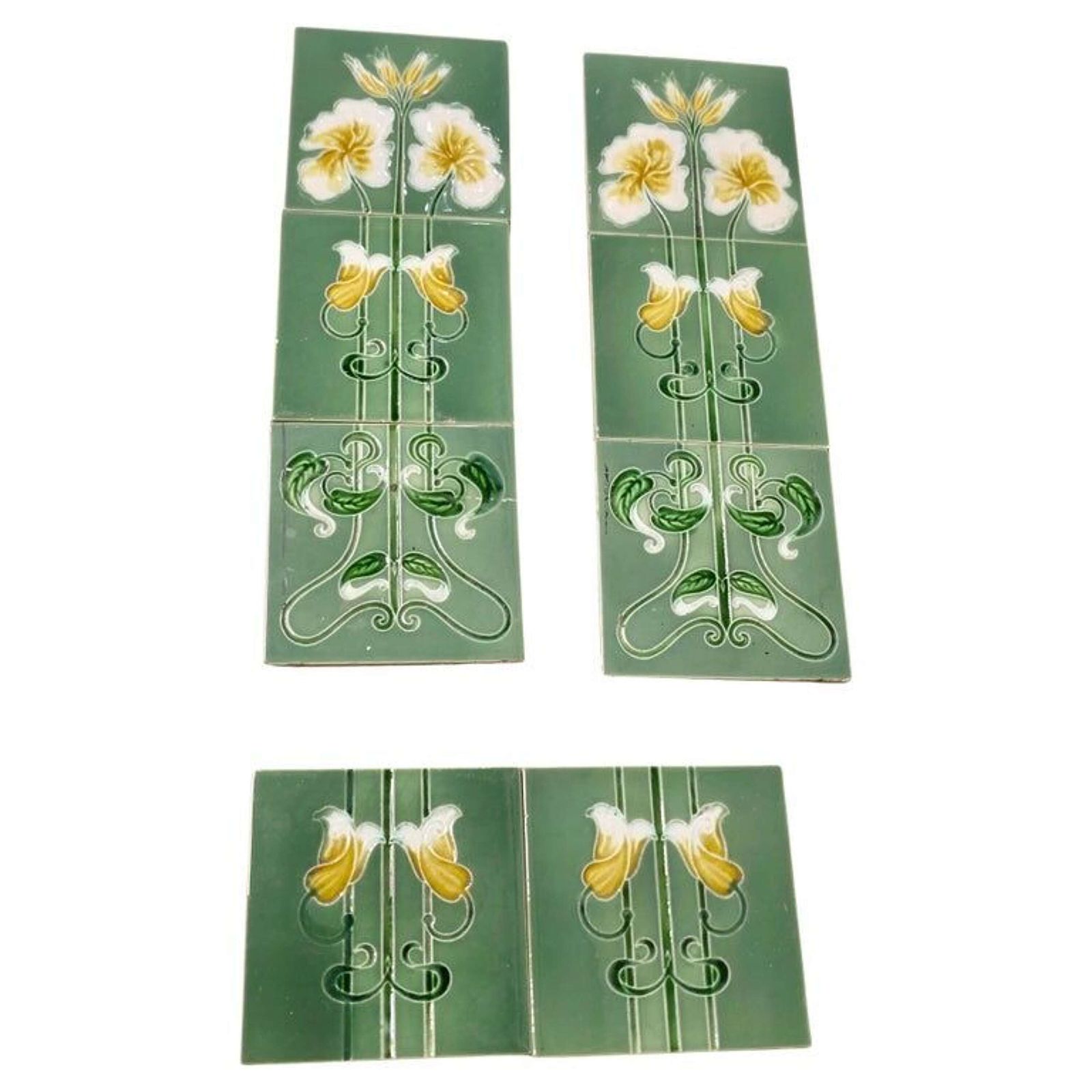 A Set Of 8 Art Nouveau Embossed Ceramic Tiles