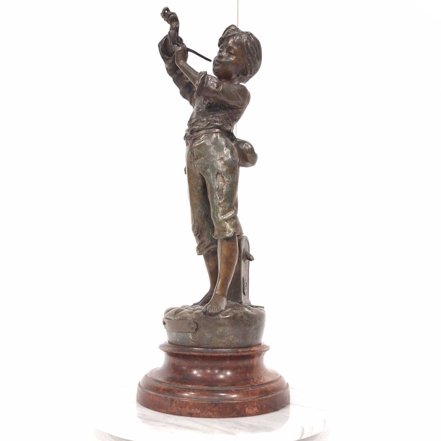 A French Spelter Statue Of A Boy Lighting A Pipe photo vintage