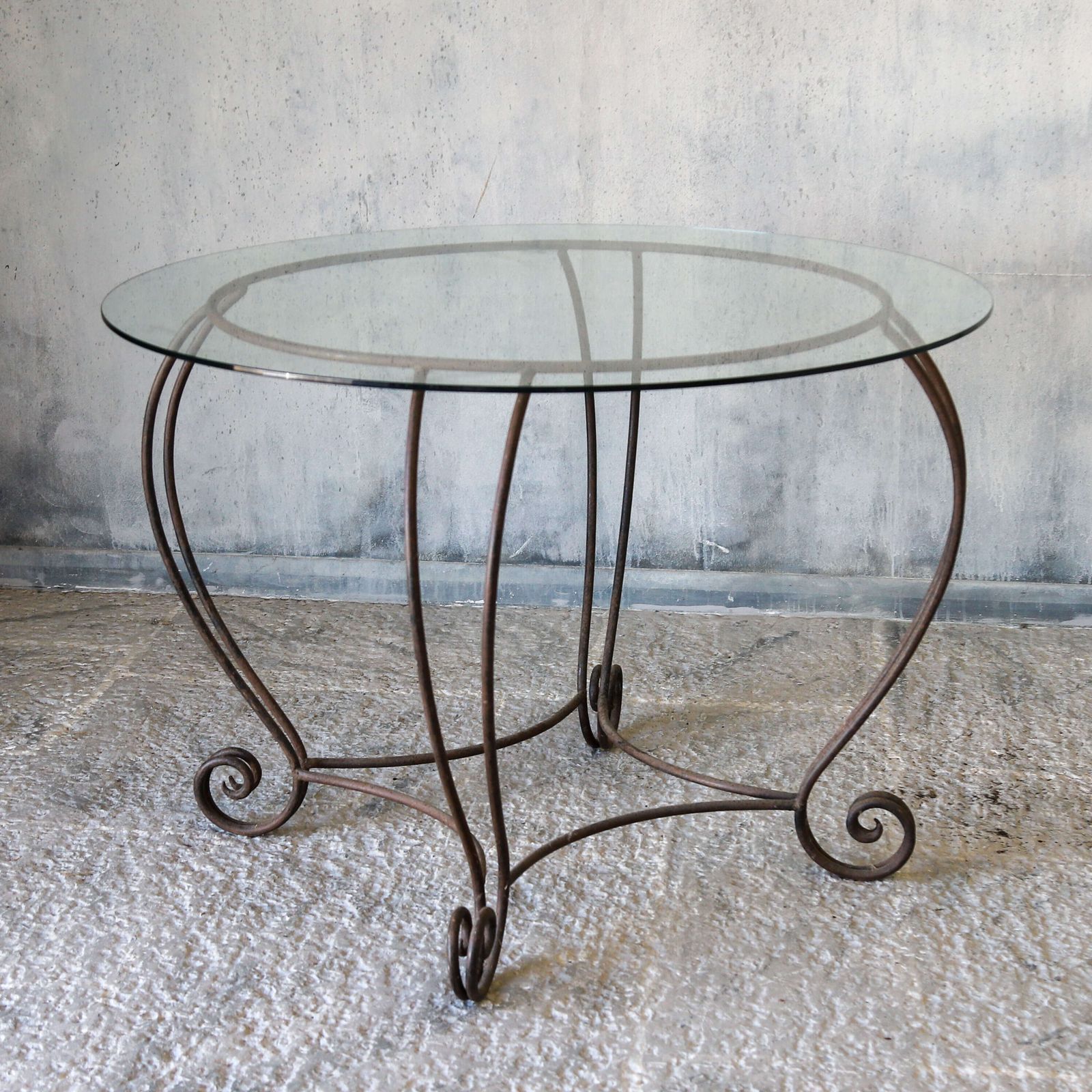 Stylish Mid Century Circular Table With Bevelled Glass Top And Decorative Metal Base photo vinterior