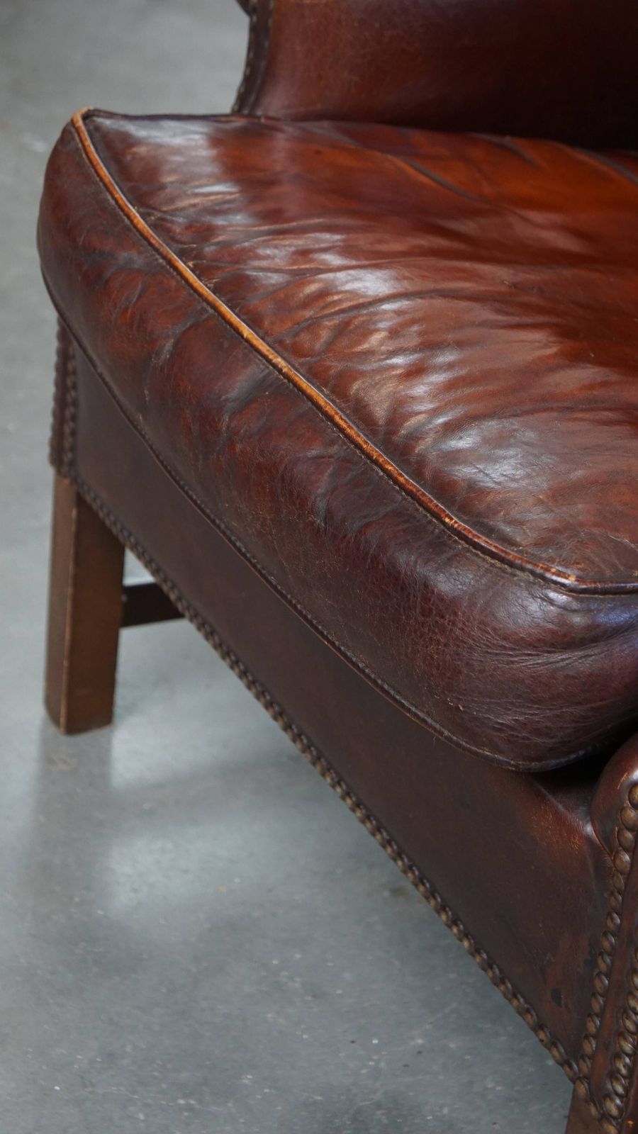 photo for sale Luxurious, Classic And Comfortable Dark English Style Sheepskin Wing Chair With Lots Of Character And A Beautiful Patina