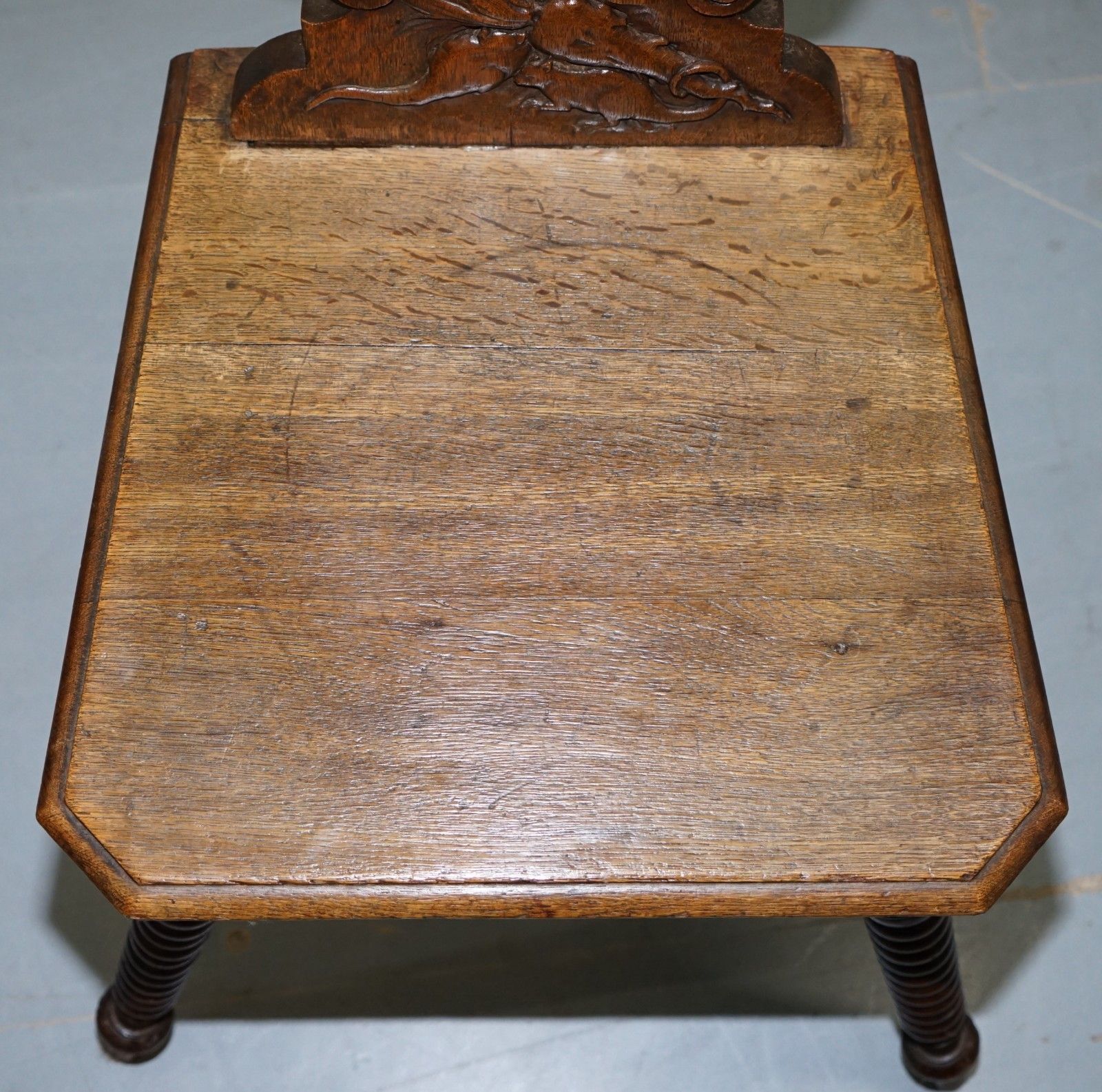 Black Forest Carve Oak Bobbin Hall Chair Depicting Two Friends Hugging Scrooge photo vinterior