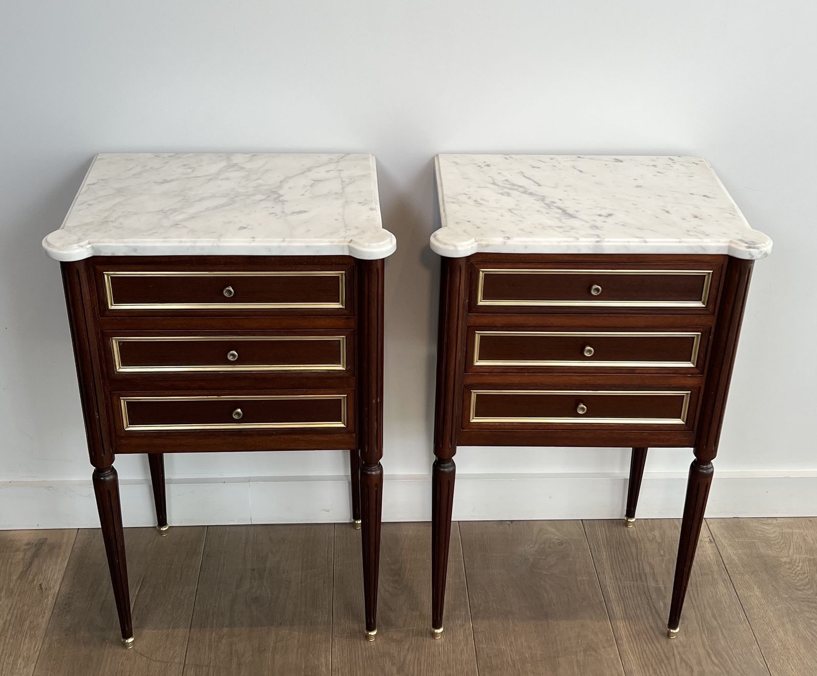 Pair Of Mahogany And Brass End Tables Or Bedside Tables With Carrara Marble Tops In The Style Of Maison Jansen. Circa 1940 photo for sale
