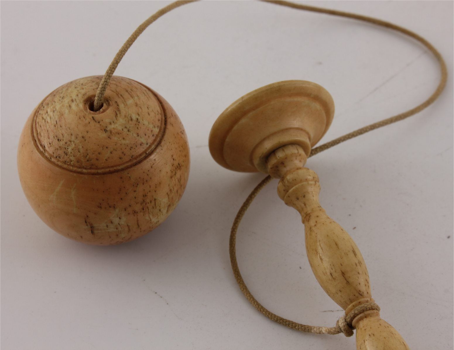 Bone Cup & Ball Game. Bilbocatch Bilboquet Game Of Skill. C1820. photo vintage