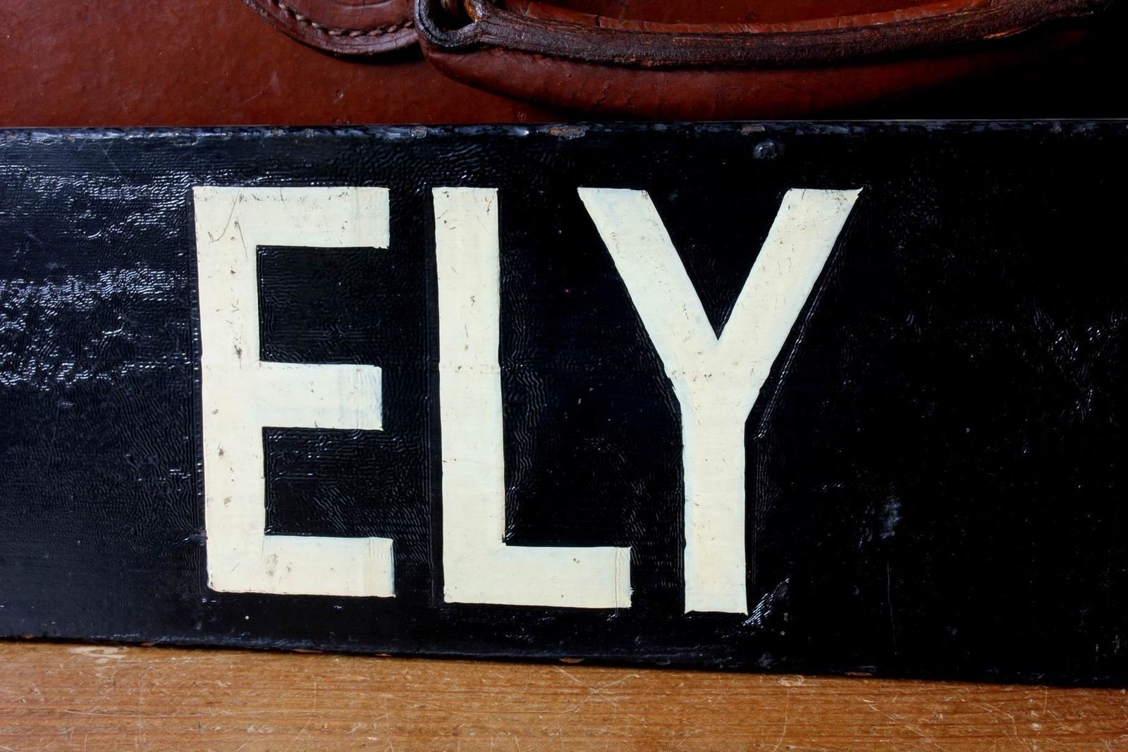 Antique Ely Train Destination Sign. Black Railway Station Signage. photo vintage