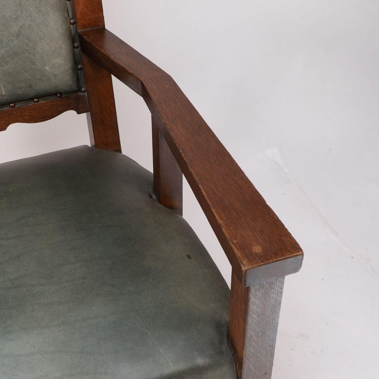 Furniture Heal And Son (Attributed). An Arts And Crafts Six Legged Oak Armchair photo