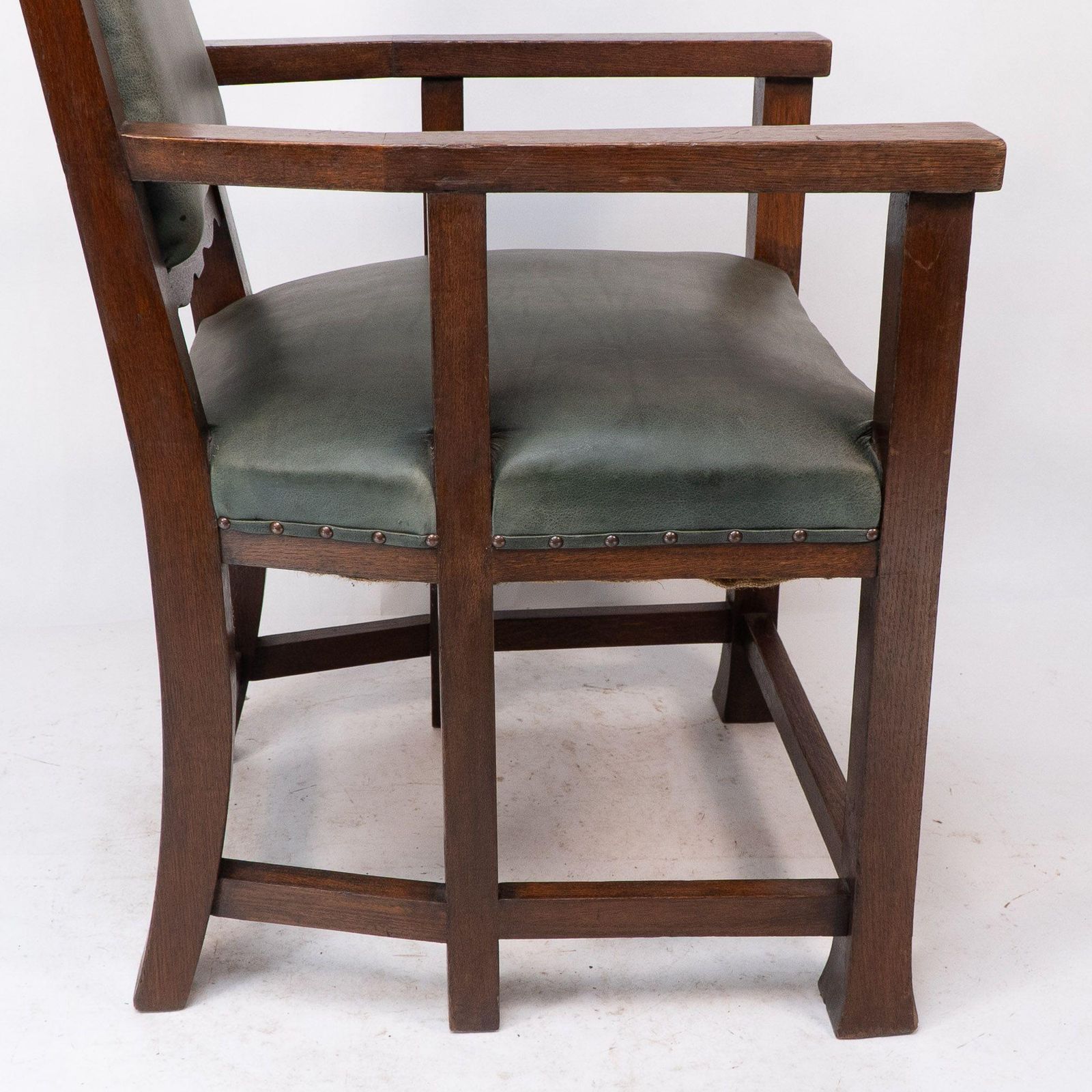 2244.0 Heal And Son (Attributed). An Arts And Crafts Six Legged Oak Armchair photo