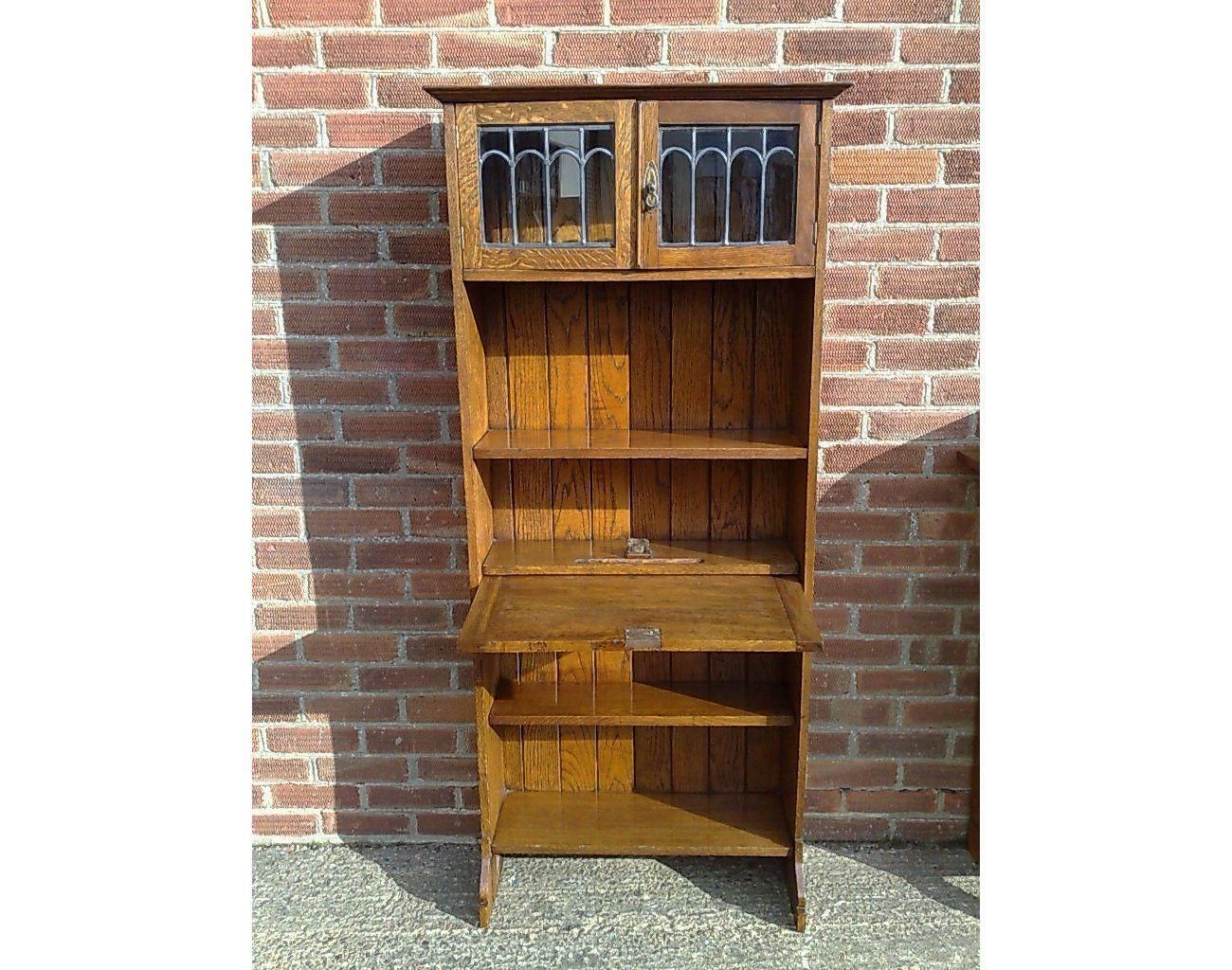 An Arts And Crafts Tall Oak Bureau Bookcase With Leaded Glass Doors photo furniture