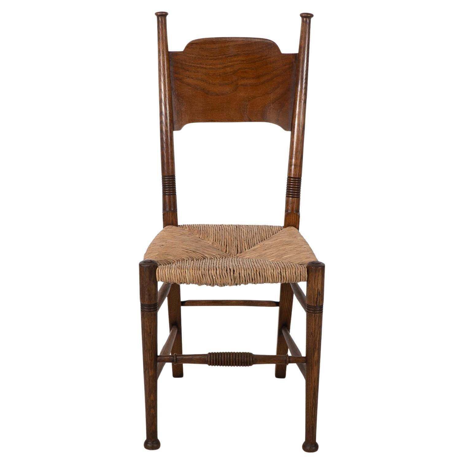 William Birch. Liberty & Co. A Arts And Crafts Rush Seat Oak Dining Chair