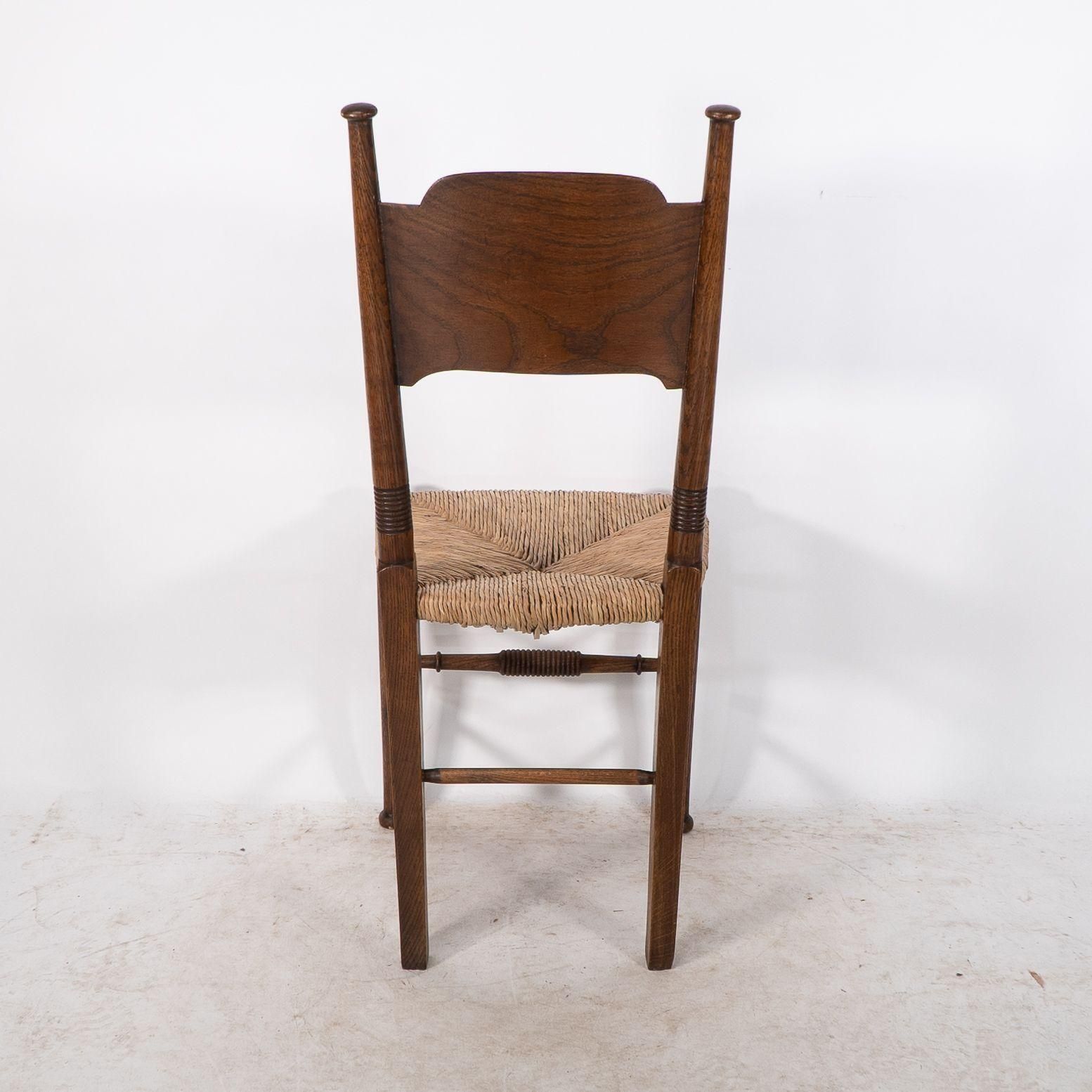 photo vinterior William Birch. Liberty & Co. A Arts And Crafts Rush Seat Oak Dining Chair
