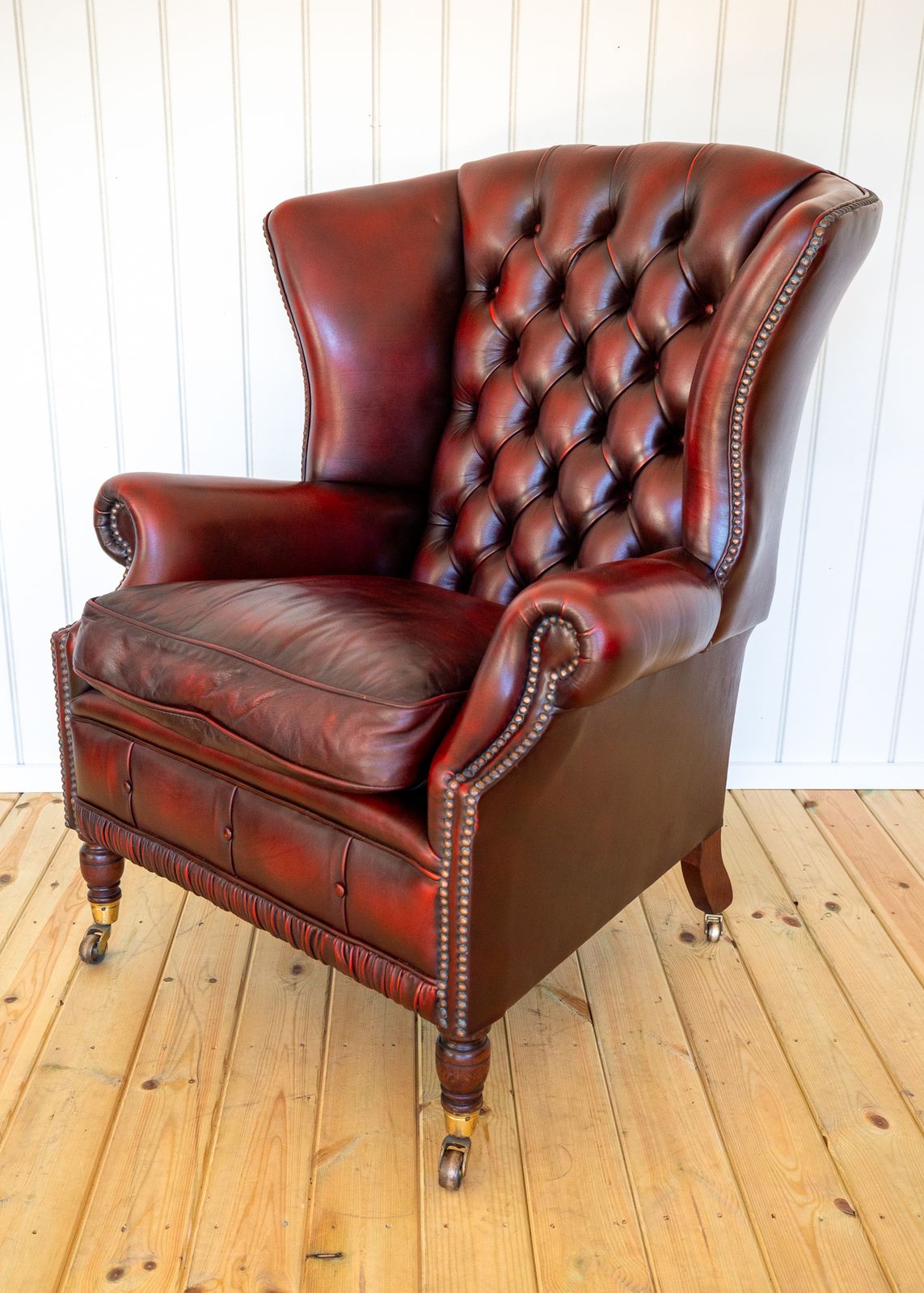 photo furniture Harrods Wingback Chesterfield Armchair Georgian Style Oxblood Red 1990s Casters Fireside Chair Fine Country House