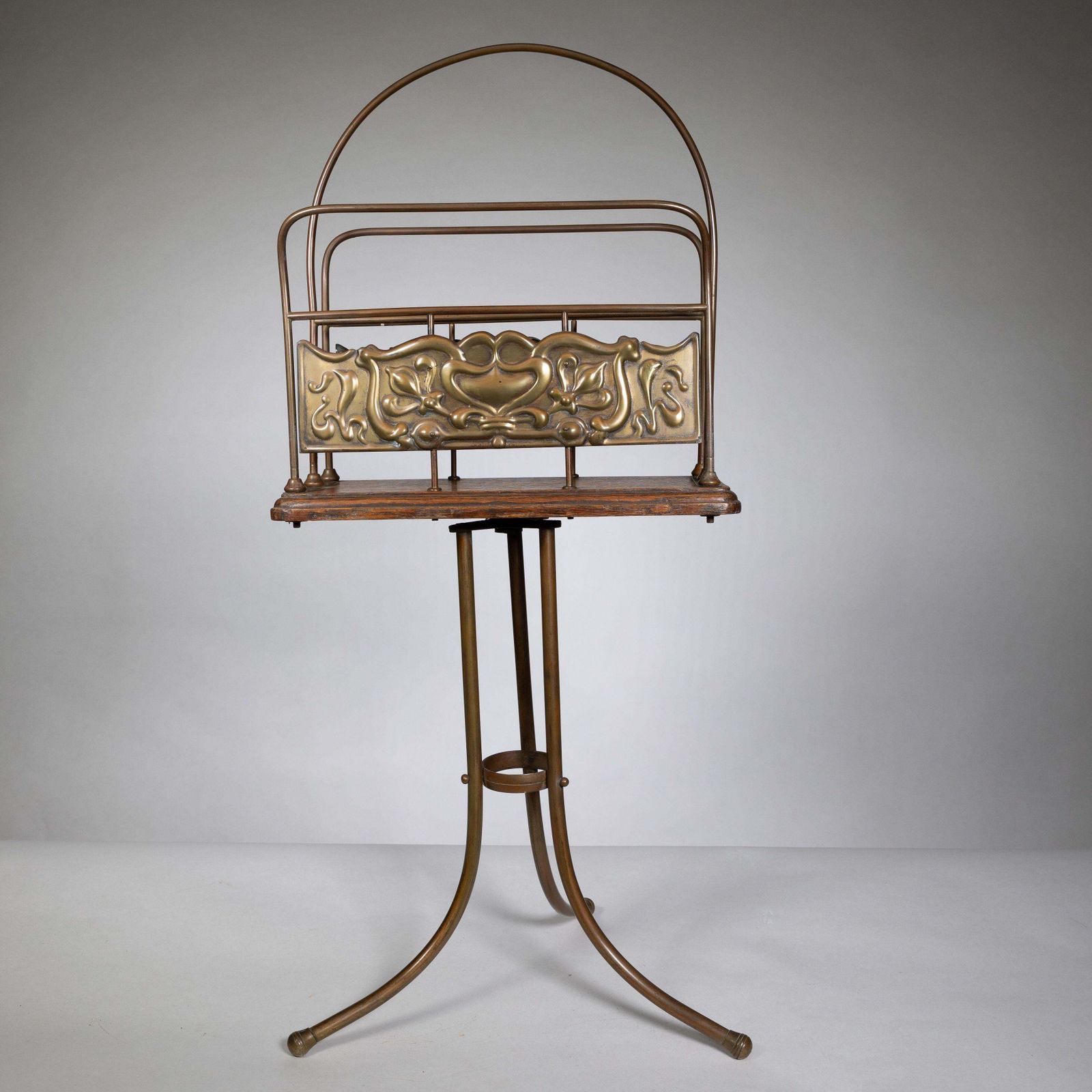 Townshends Brassfounders. An Arts & Crafts Revolving Tripod Magazine Rack photo for sale