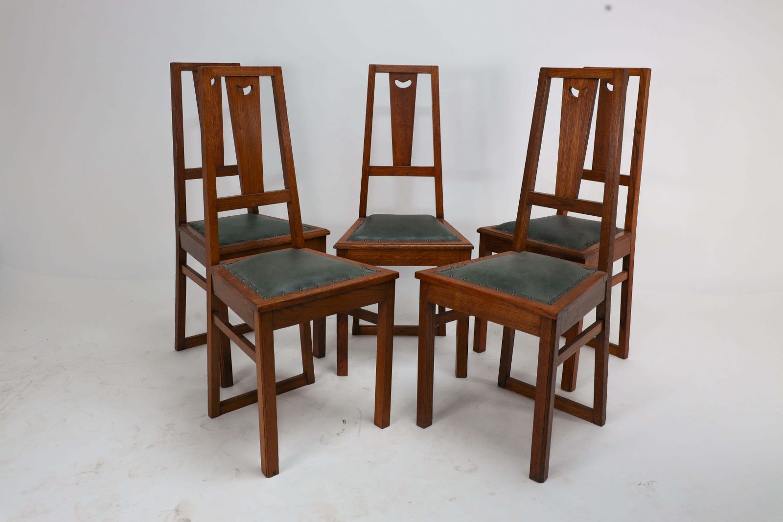 E A Taylor. A Set Of Five Arts And Crafts Oak Side Chairs With Heart Cut Outs. photo furniture