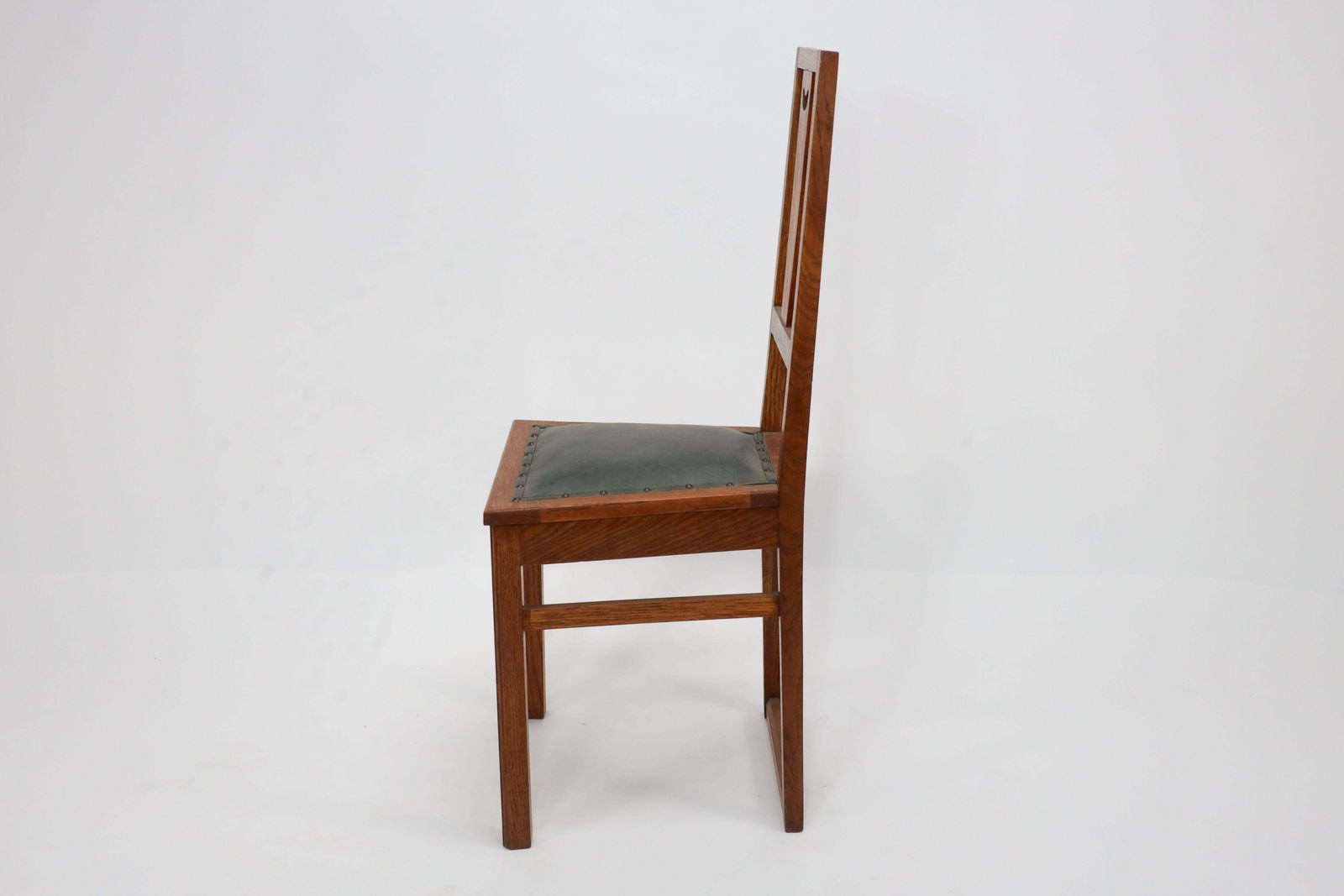 E A Taylor. A Set Of Five Arts And Crafts Oak Side Chairs With Heart Cut Outs. photo 3825.0