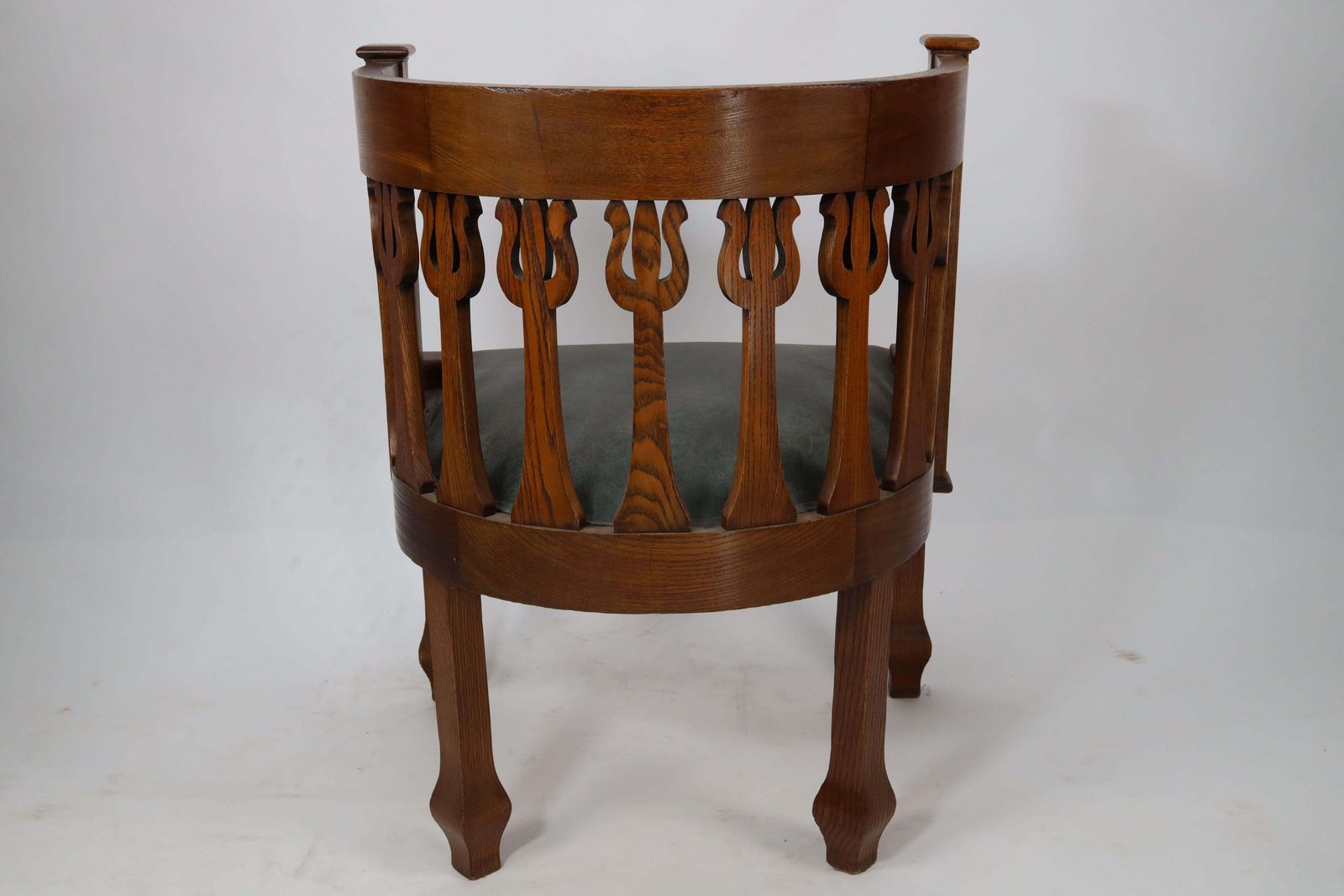An Arts And Crafts Oak Armchair With Stylized Floral Upright Decoration photo 1786.0