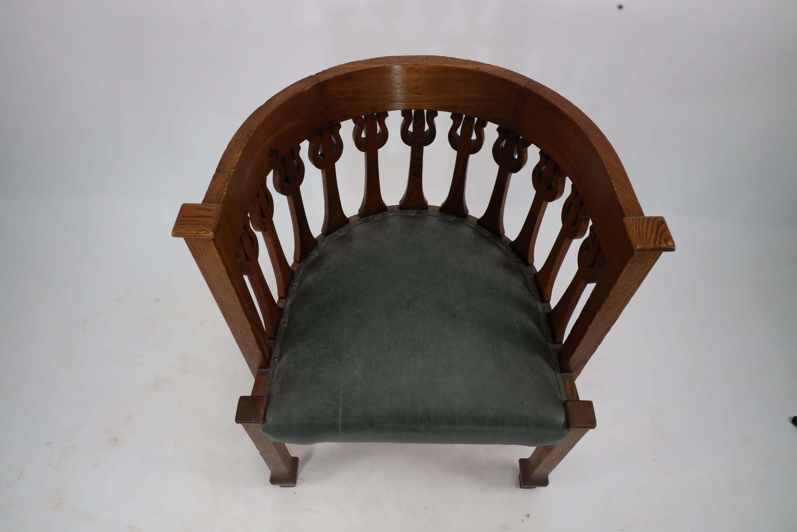 An Arts And Crafts Oak Armchair With Stylized Floral Upright Decoration photo vintage