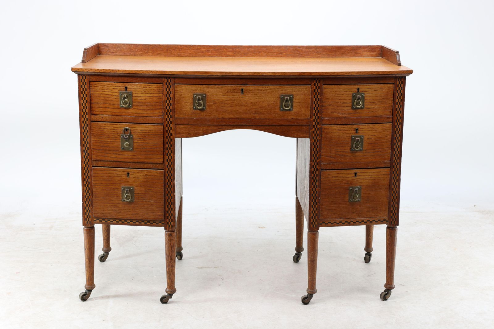 Waring And Gillow. An Arts And Crafts Bow Fronted Kneehole Twin Pedestal Desk photo furniture