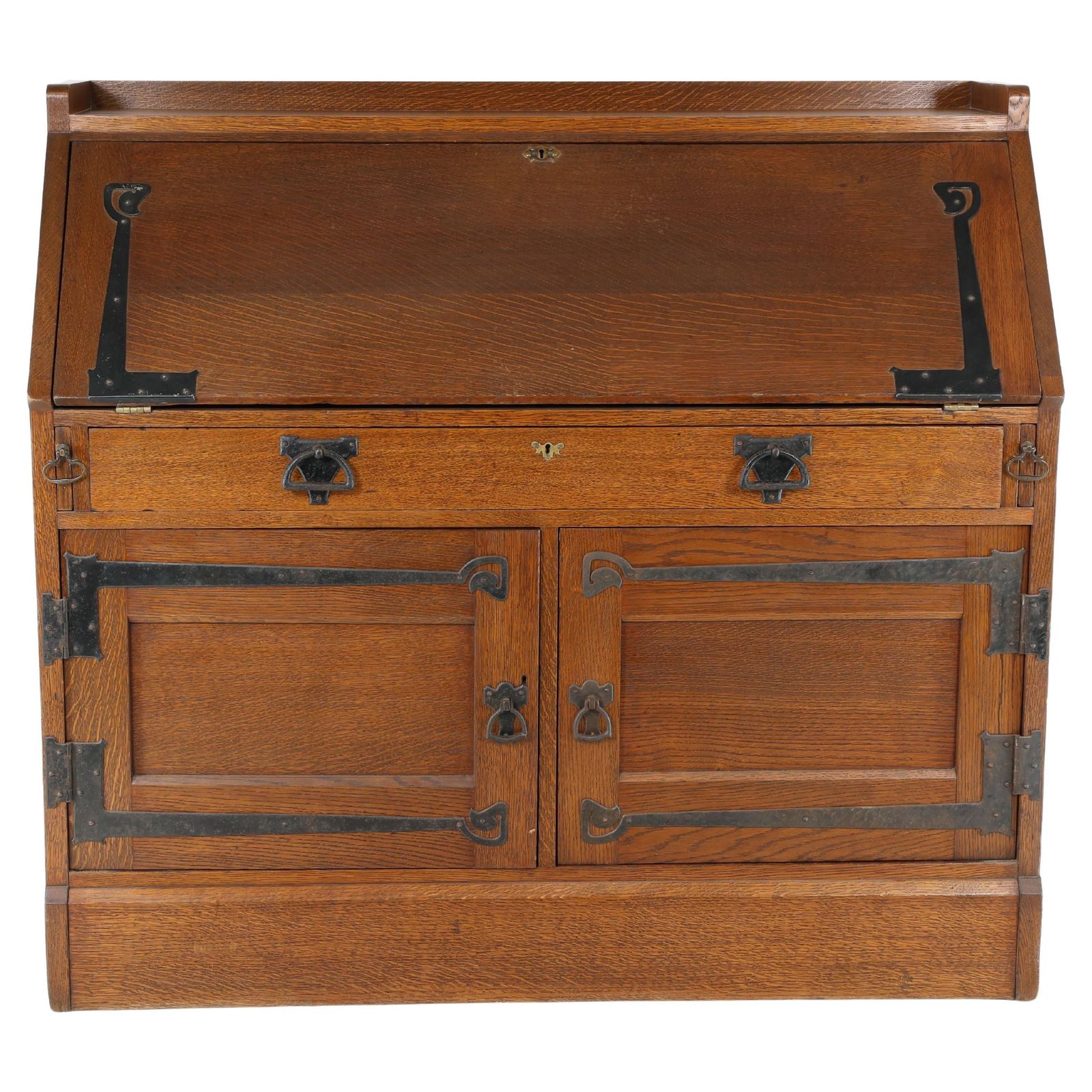 Leonard Wyburd For Liberty & Co. An Arts & Crafts Oak Bureau With Iron Hinges