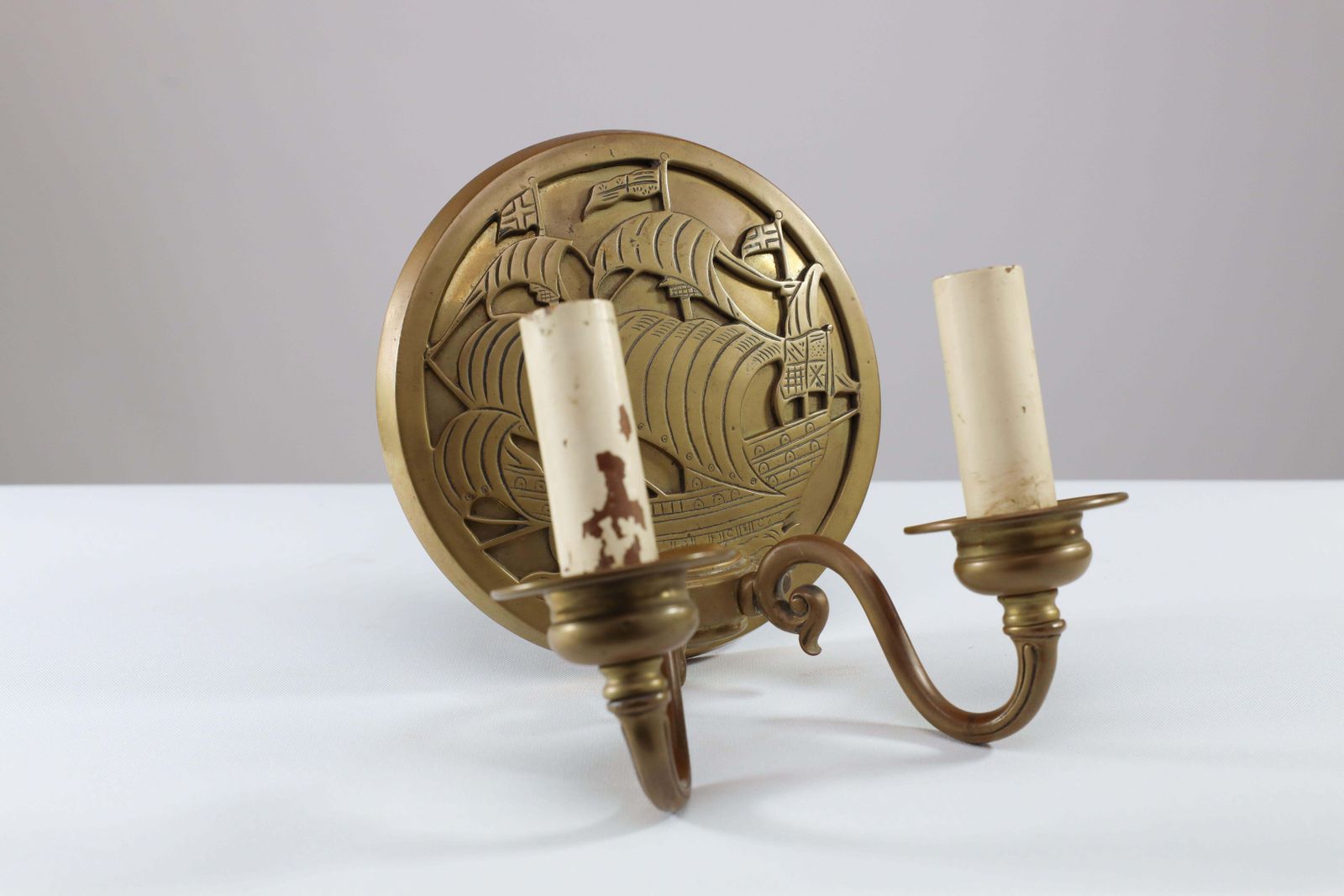 A Pair Of Arts And Crafts Brass Wall Lights With Galleons In Sail. photo Lighting