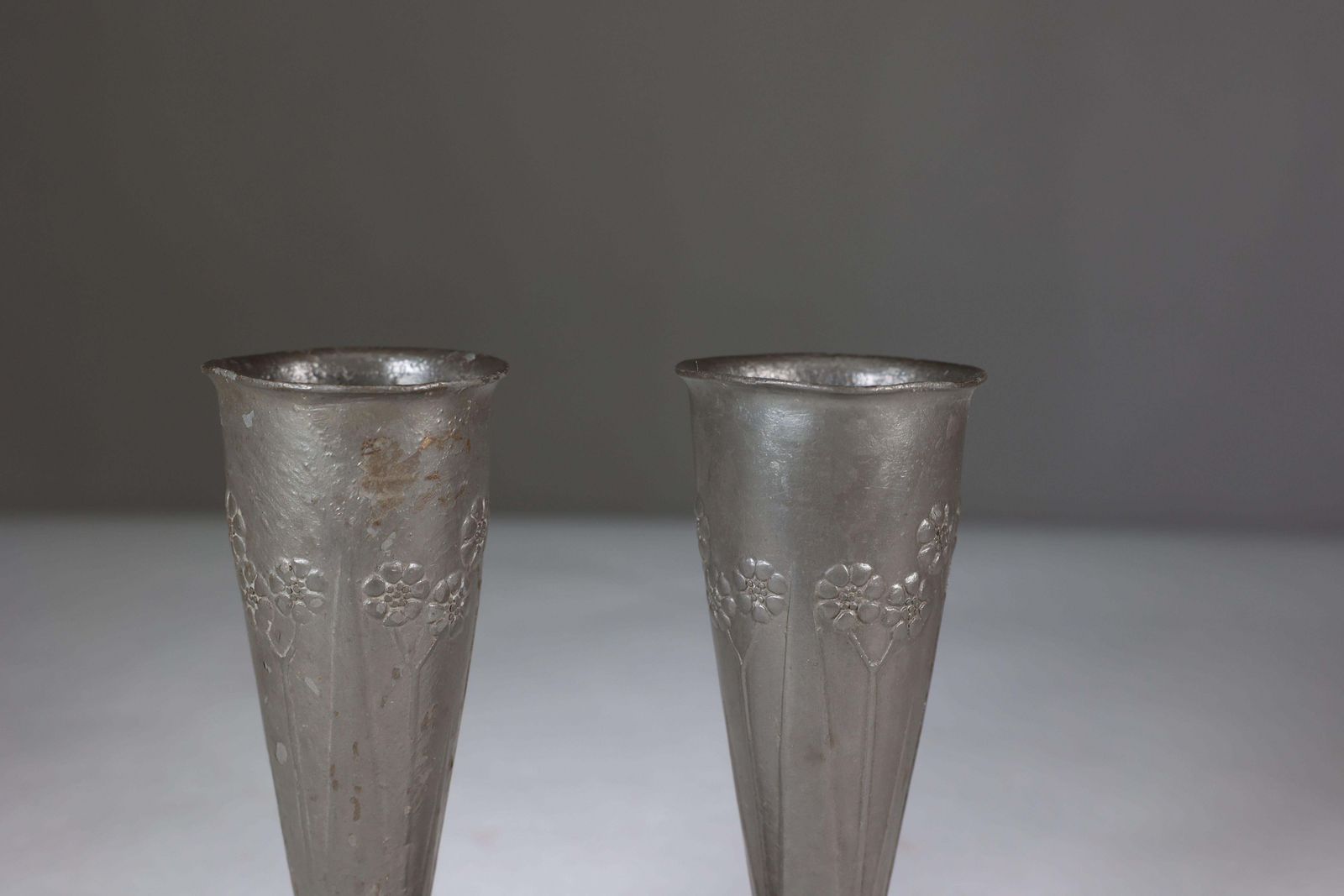 photo furniture Liberty And Co. A Pair Of Tudric Pewter Vases