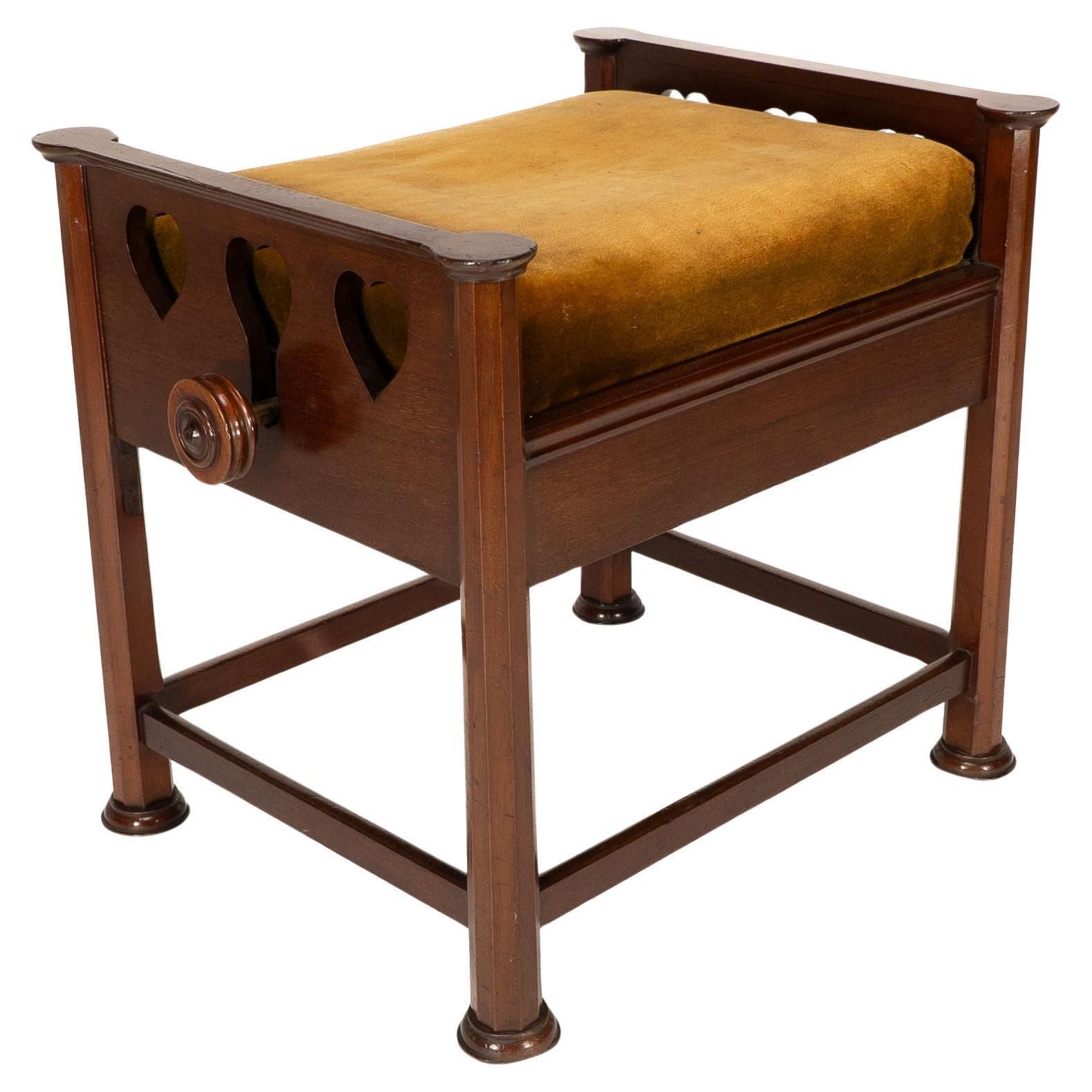 J S Henry In The Style Of Voysey. An Arts & Crafts Walnut Adjustable Piano Stool