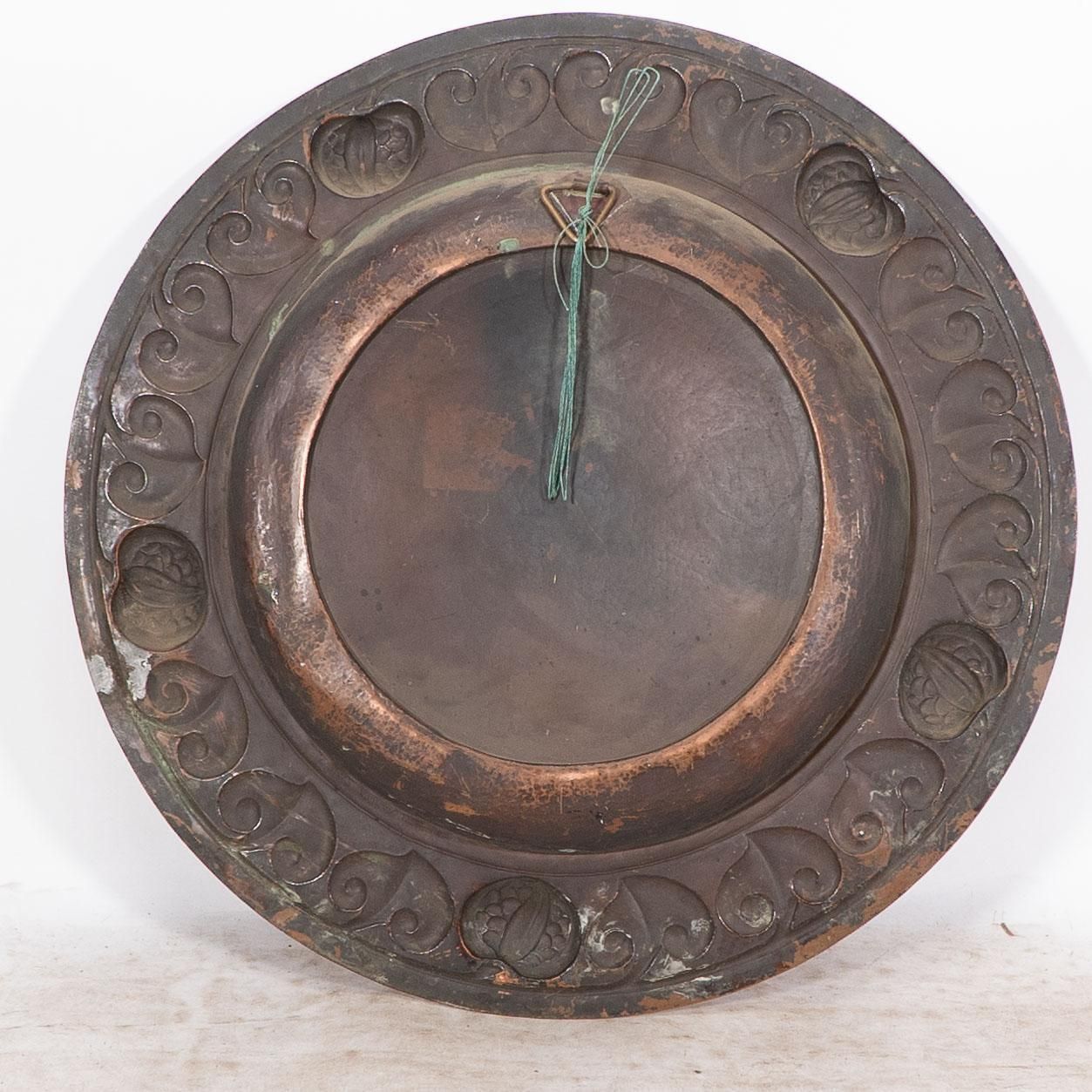 photo for sale A Large Arts And Crafts Hand Formed Copper Charger With Stylized Decoration