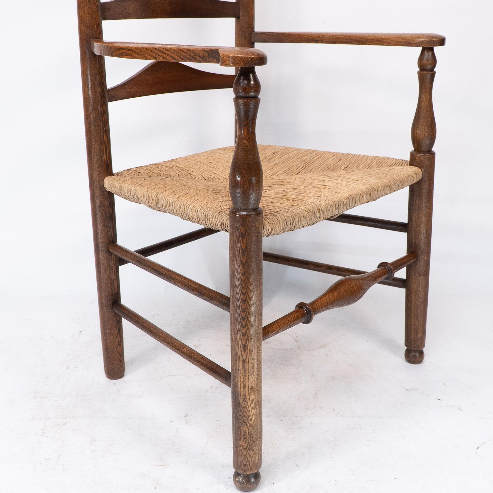 2550.0 C R Ashbee Attr. An Arts & Crafts Oak Ladder Back Armchair With Re Rushed Seat photo