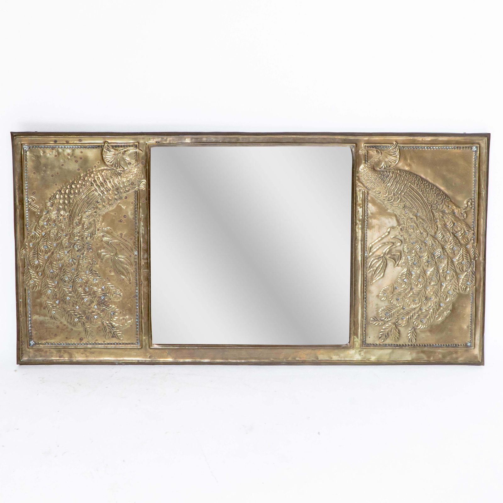 An Aesthetic Movement Brass Mirror With Stylized Peacocks Perched On A Branch photo furniture