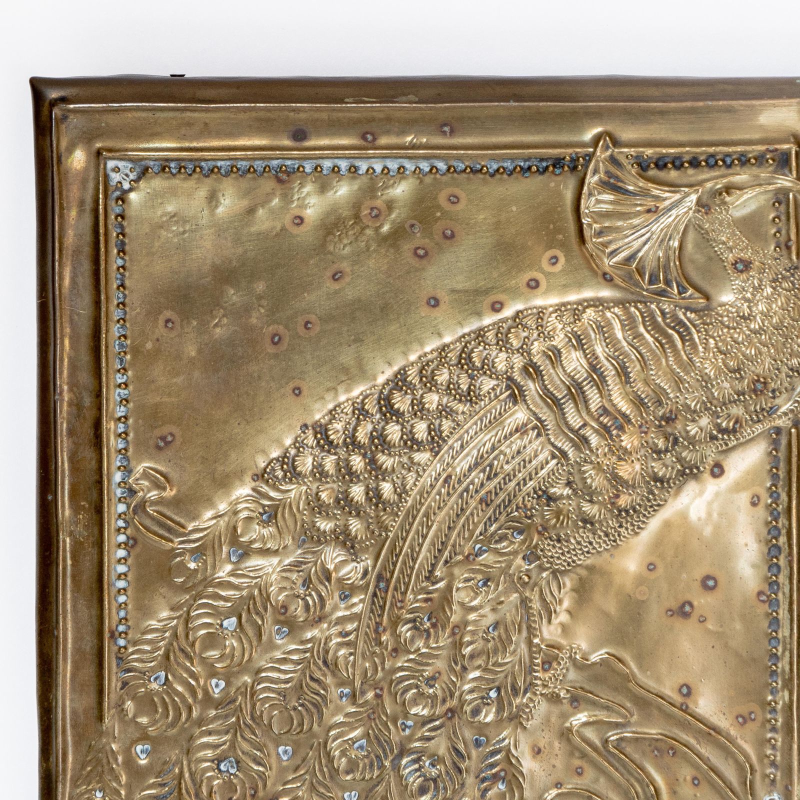 An Aesthetic Movement Brass Mirror With Stylized Peacocks Perched On A Branch photo 2500.0