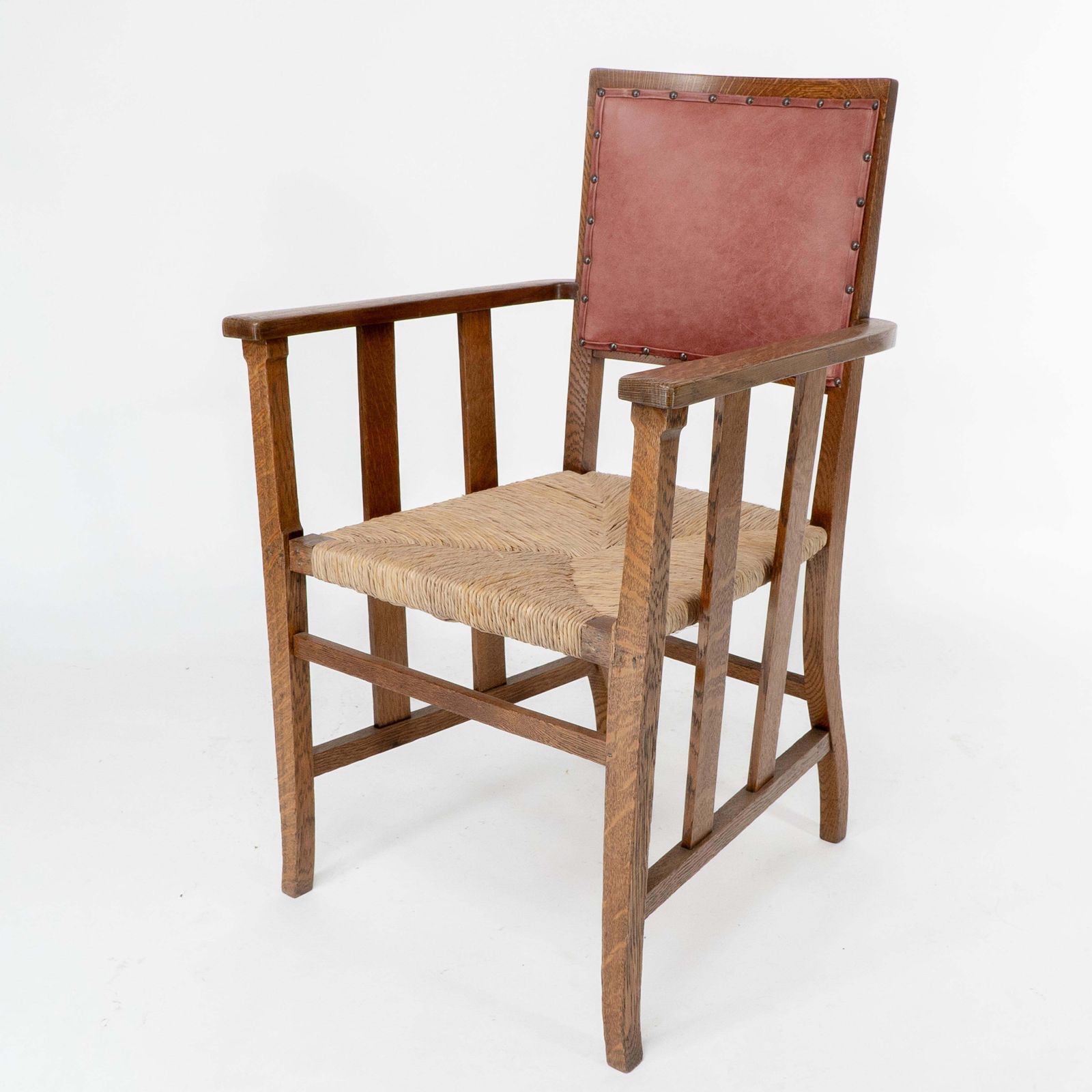 Liberty & Co. An Arts & Crafts Rush Seat Armchair With A Shaped Back photo for sale