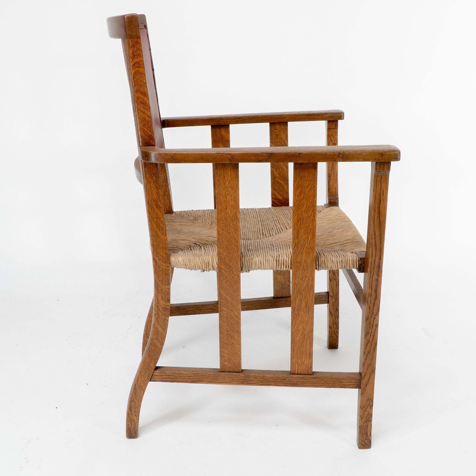Liberty & Co. An Arts & Crafts Rush Seat Armchair With A Shaped Back photo Furniture