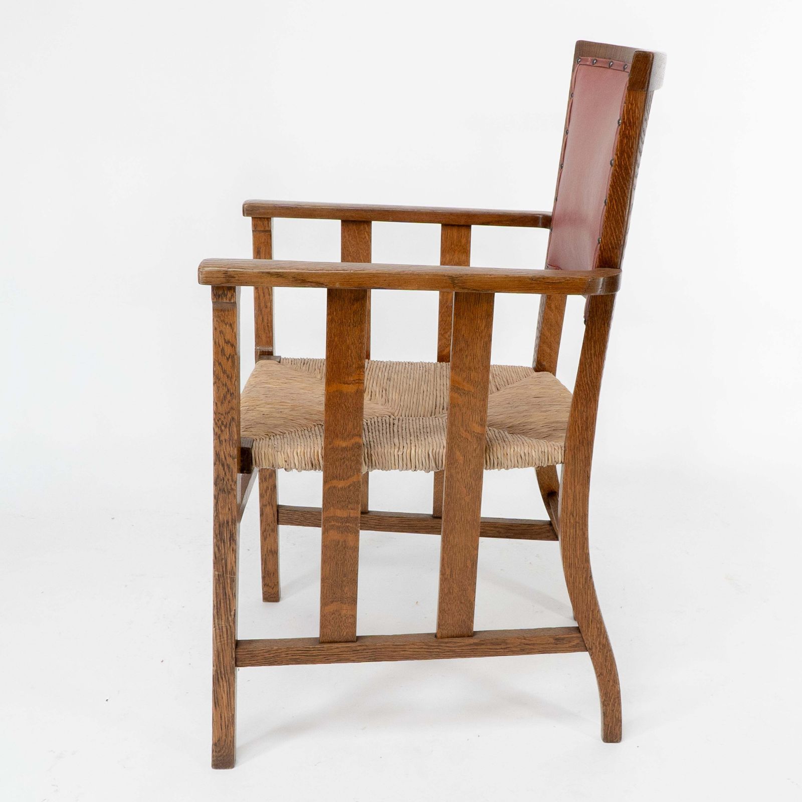Liberty & Co. An Arts & Crafts Rush Seat Armchair With A Shaped Back photo 1836.0