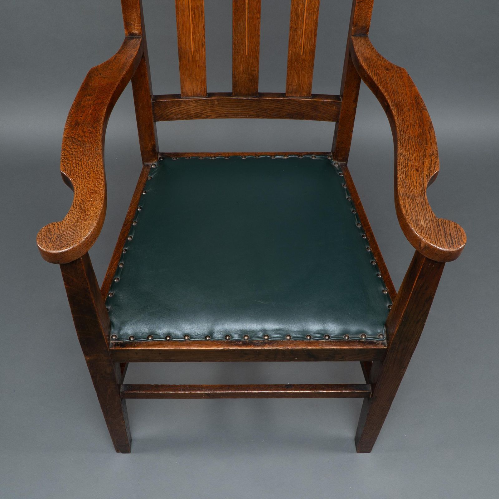 Furniture Liberty & Co Attributed. An Arts & Crafts Oak Armchair With Inlaid Royal Crown photo