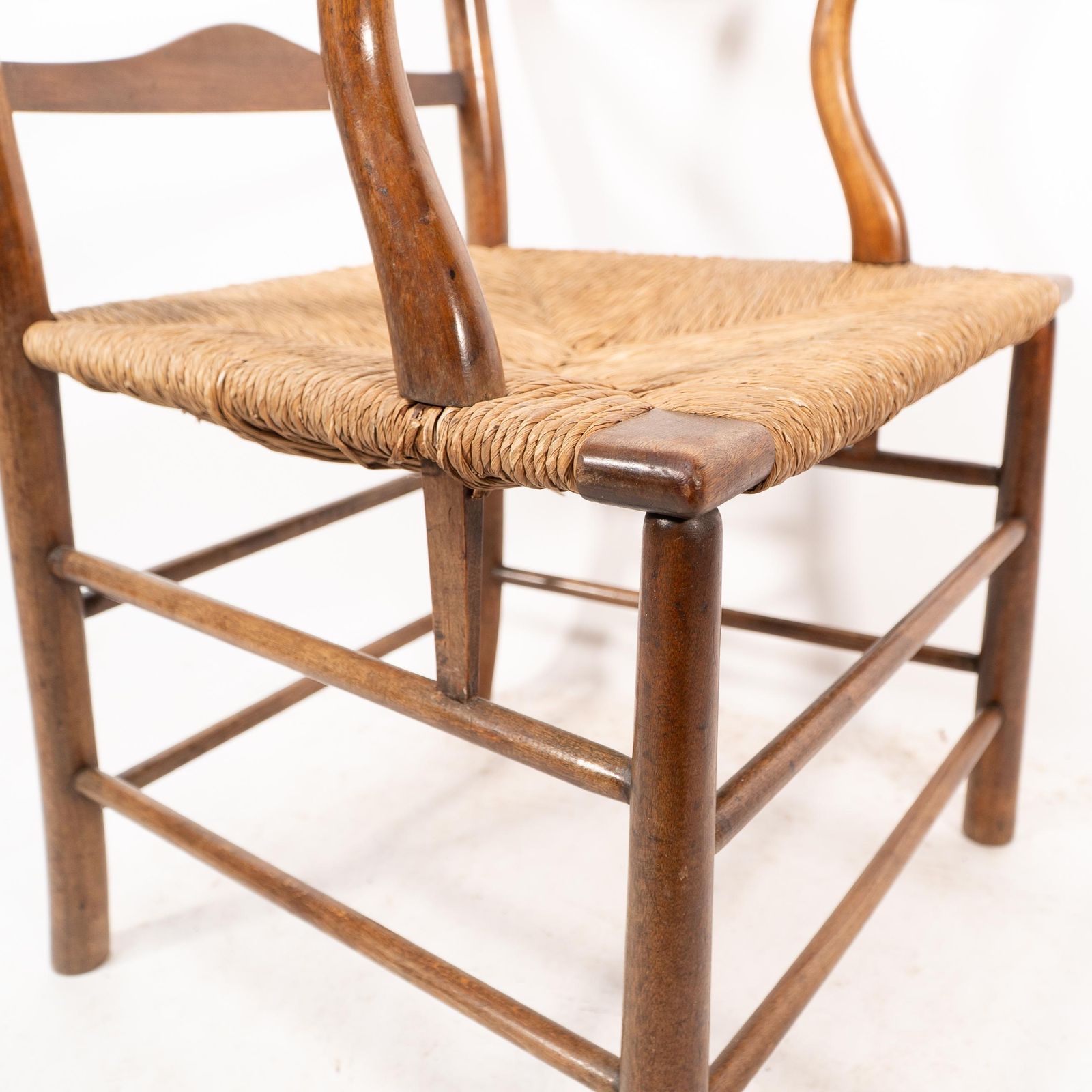 photo vinterior C R Ashbee. An Arts And Crafts Rush Seat Ladder Back Armchair