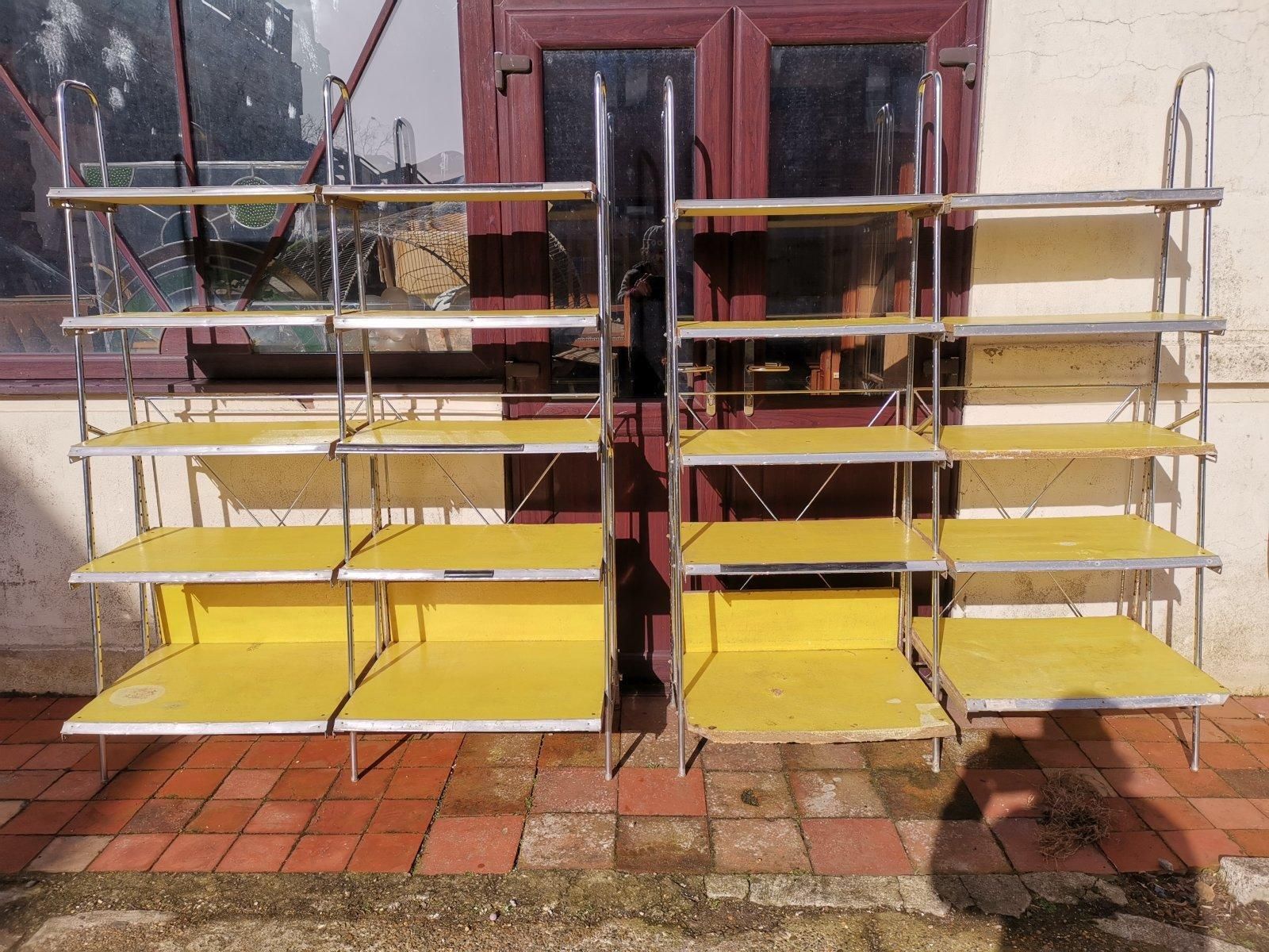 photo vinterior Stylish Midcentury Chrome On Steel Shop Shelving With Braced Back Supports