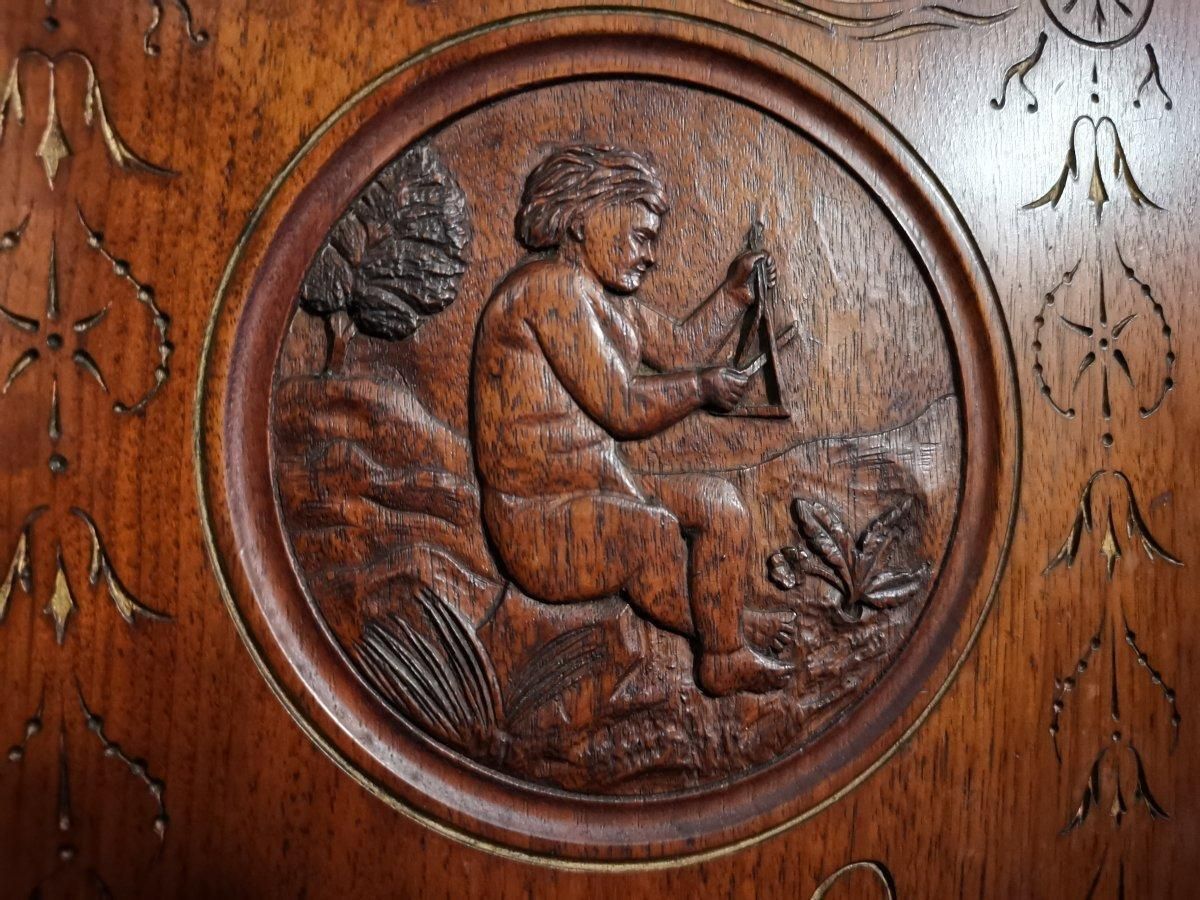 4895.0 Aesthetic Movement Side Cabinet With Carved Panels Of Putti Putti Playing Music. photo