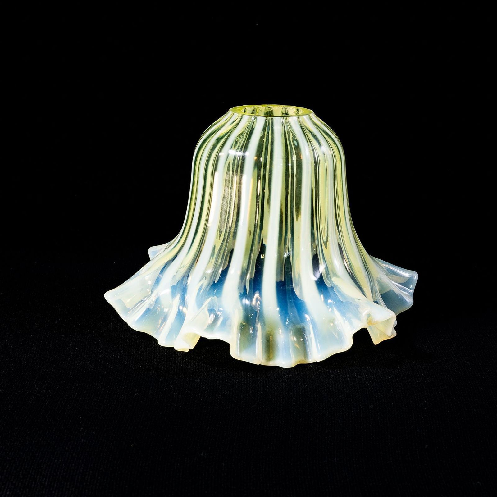 A Pleated Vaseline Shade, Consisting Of Alternating Stripes And A Ruffled Rim. photo furniture